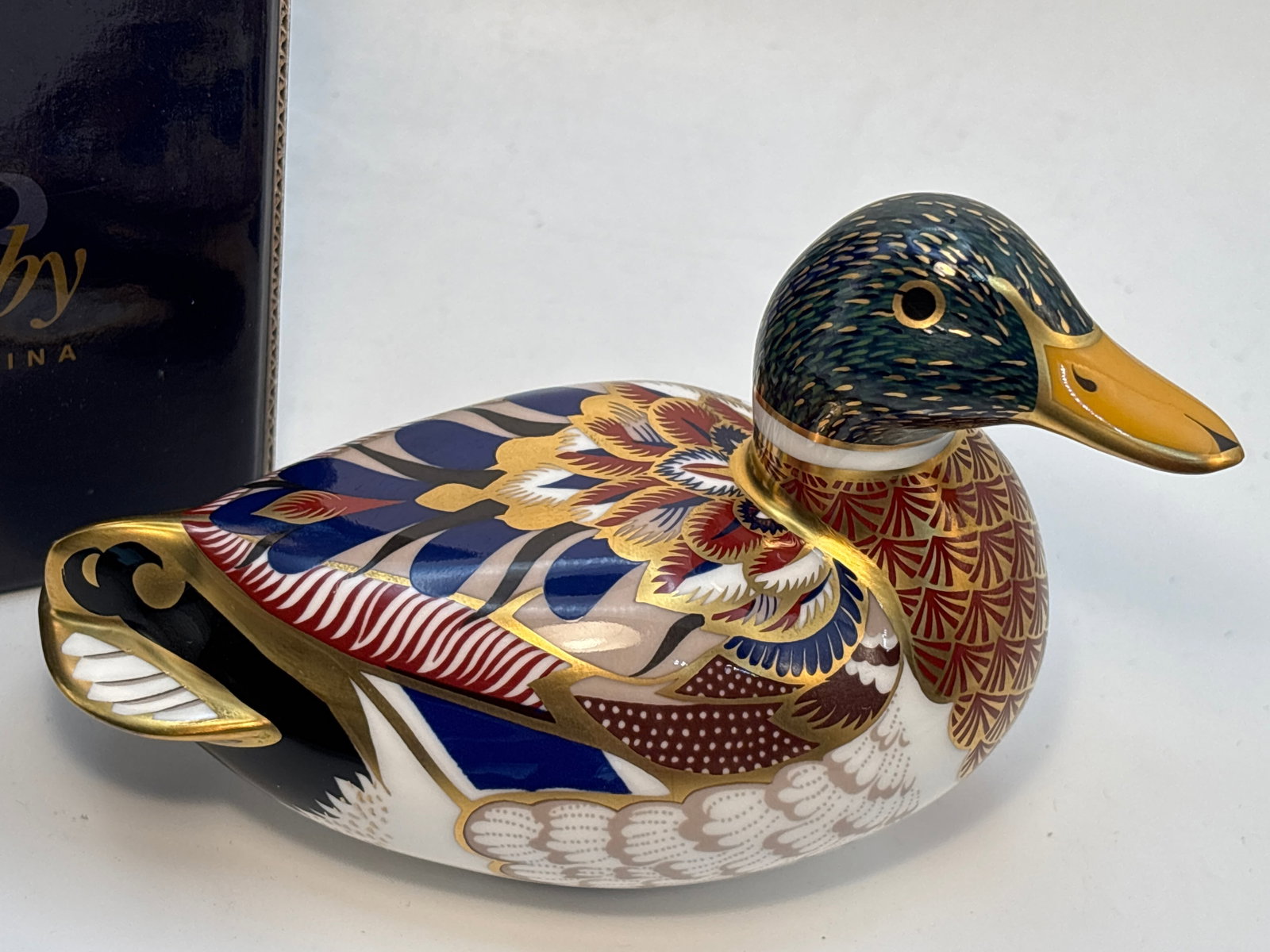 Handsome Mallard duck Royal Crown Derby 5 inch paperweight: Mallard duck Royal Crown Derby 5 inch paperweight paperweight.Gold stopper. With box.Very good condition; no chips, cracks, etc
