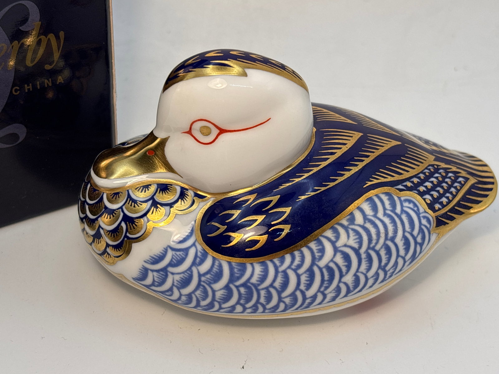 Imari blue ‘Peking duck’ Royal Crown Derby 4.5 inch paperweight: Peking duck Royal Crown Derby 4.5 inch paperweight. Silverstopper. With box.Very good condition; no chips, cracks, etc
