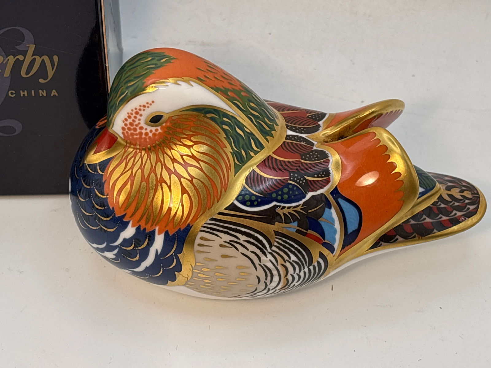 Fabulous Imari ‘Mandarin Duck’ Royal Crown Derby English bone china 5 inch paperweight: Imari ‘Mandarin Duck’ Royal Crown Derby English bone china 5 inch paperweight.Silver stopper. Box is worn and not original.Very good condition; no chips, cracks, etc