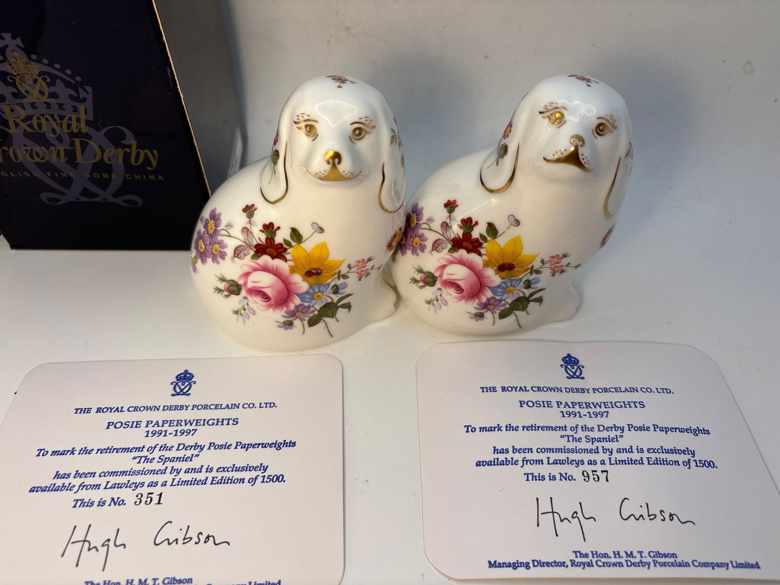 Two limited edition ‘The Spaniel’Royal Crown Derby Posies 4 inch paperweights: Two limited edition ‘The Spaniel’Royal Crown Derby Posies 4 inch paperweights.Silver stoppers. Original COA. One with box.Very good condition; no chips, cracks, etc
