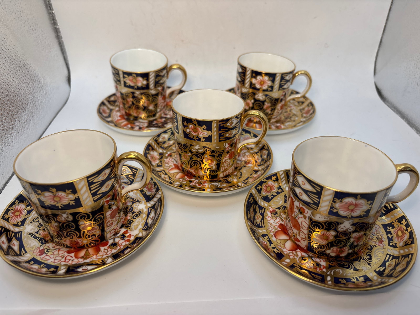 Set of five Imari #2451 pattern Royal Crown Derby demitasse cups w/saucers, 1st quality: Set of five Imari #2451 pattern Royal Crown Derby demitasse cups with saucers.; 1st quality.They are 2&1/4” by 2&1/4” and saucers are 4&1/2 inches.One has interior staining.Beautiful condi