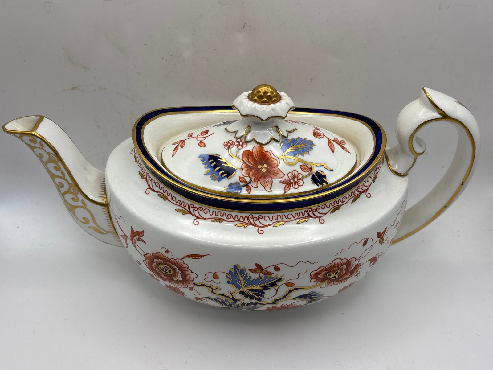 Antique A.720 Smooth Royal Crown Derby covered tea pot; 6&1/2x10 inch: Antique A.720 Smooth Royal Crown Derby covered tea pot; 6&1/2x10 inch. Marked on bottom with logo and A720. No chips, cracks, etc.