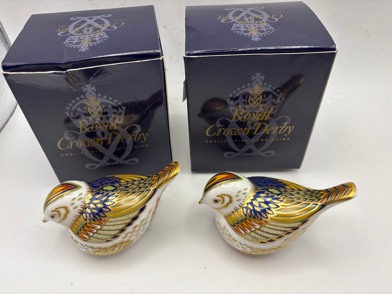 Two 1999 collectors guild ‘Firecrest’ birds Royal Crown Derby English china2&1/2 inch: Two 1999 ‘Firecrest’ birdsRoyal Crown Derby English fine china paperweights .2&1/2 inch gold stopper, with boxes.No chips, cracks, etc.