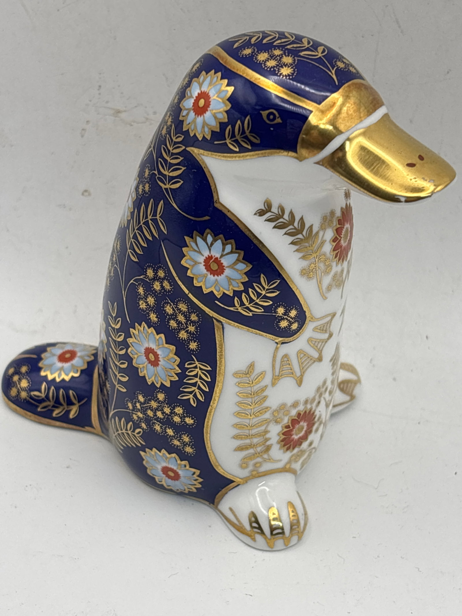 Platypus Royal Crown Derby English china 5inch paperweights: Platypus Royal Crown Derby English china 5inch paperweights. Silver stoppers. No boxes.No chips, cracks, etc.