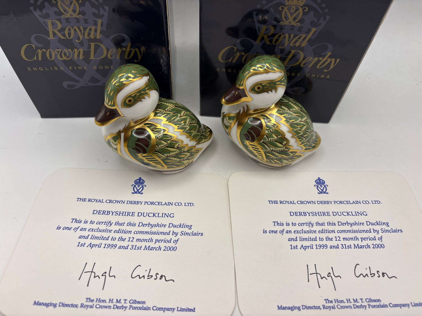 Two ‘Derbyshire Duckling’ Royal Crown Derby 3inch paperweights: Two Derbyshire Ducklings Royal Crown Derby 3inch Paperweights. Both with COA. Gold stoppers. With boxes.Very Good condition