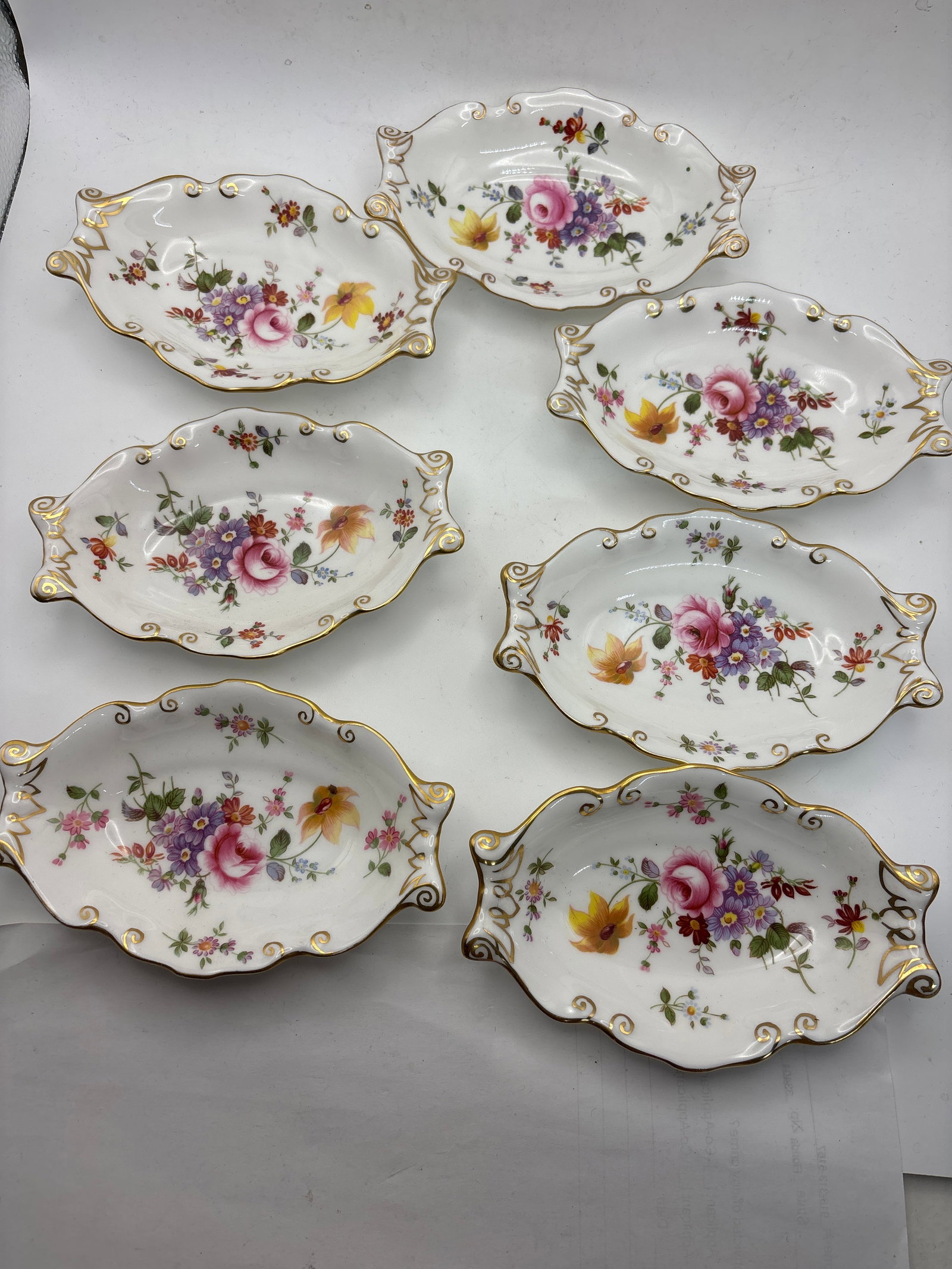 Set of seven 5&3/4 inch Derby Posies Royal Crown Derby shaped handle dishes: Set of seven 5&3/4 inch Derby Posies Royal Crown Derby small shaped handle dishes.Very good condition. No chips, cracks, etc.
