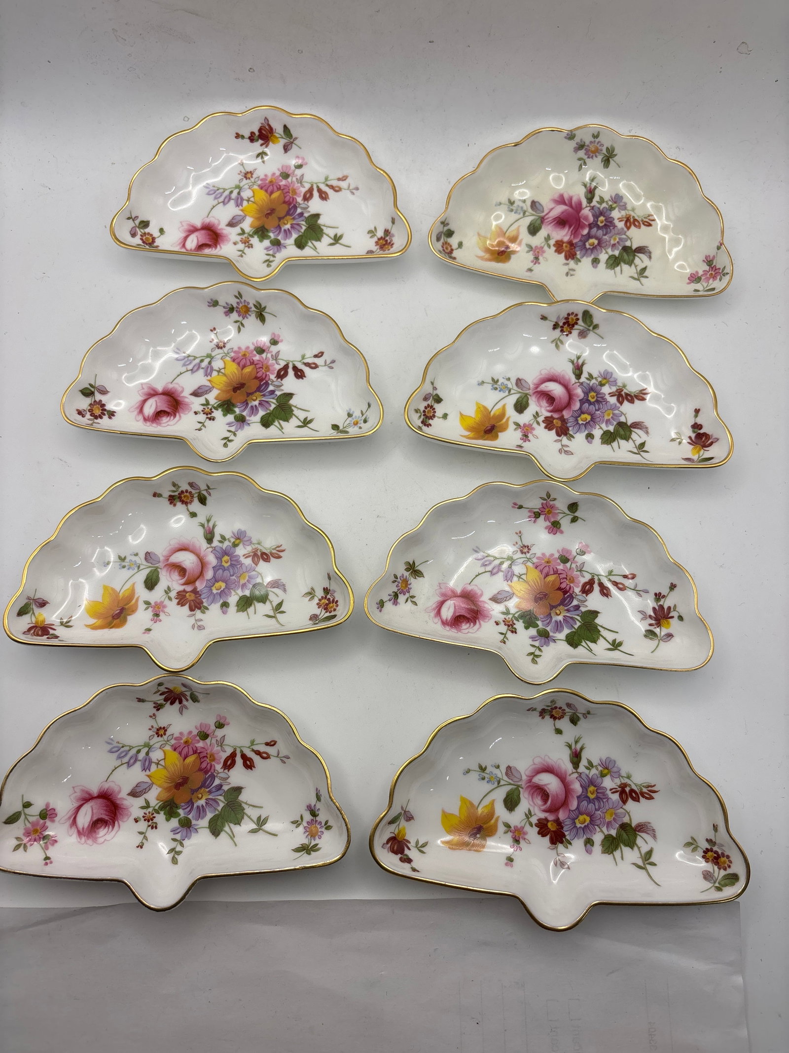 Set of eight 5 inch Derby Posies Royal Crown Derby small fan shaped dishes: Set of eight 5inch Derby Posies Royal Crown Derby fan small shaped dishes.Very good condition. No chips, cracks, etc.