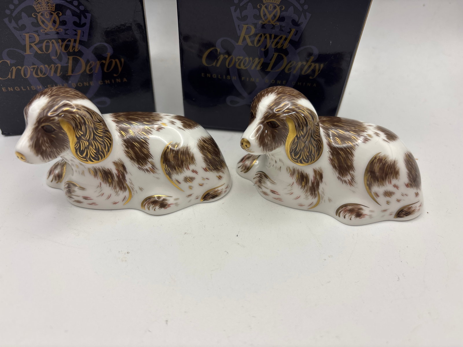2006 Two Collectors Guild ‘Scruff’ dog Royal Crown Derby 3&1/2 paperweights: Two 2006 Collectors Guild “Scruff” Royal Crown Derby 3&1/2 inch paperweights . Both gold stoppers. Both with box.Very good condition. No chips, cracks, etc.