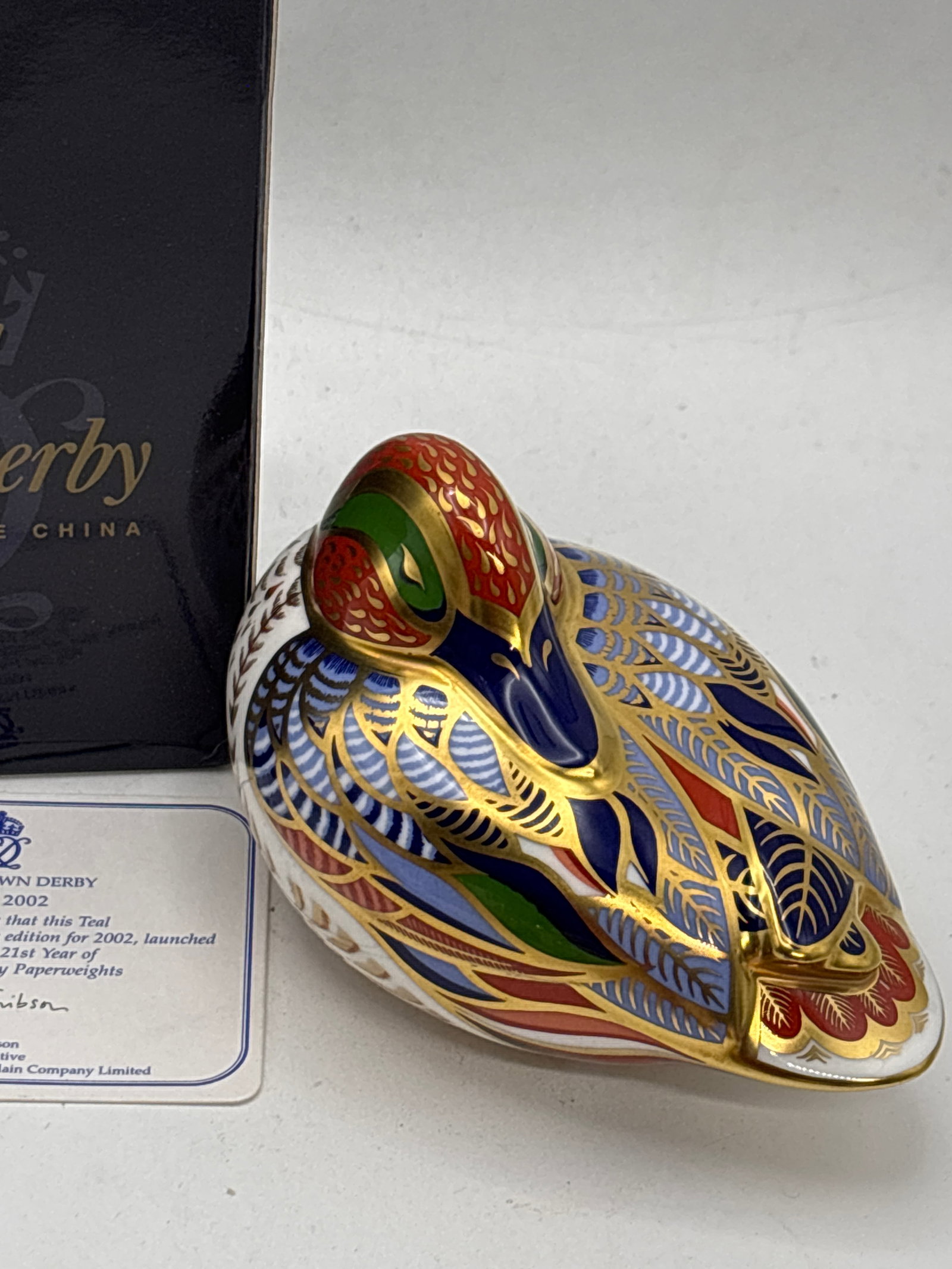 Sue Rowe design,John Abitt model Teal duck Royal crown derby 4&1/2 in paperweight: Sue Rowe design,John Abitt model Teal duck Royal crown derby 4&1/2 in paperweight . Gold stopper. Original box and certificate of authenticity. Like new