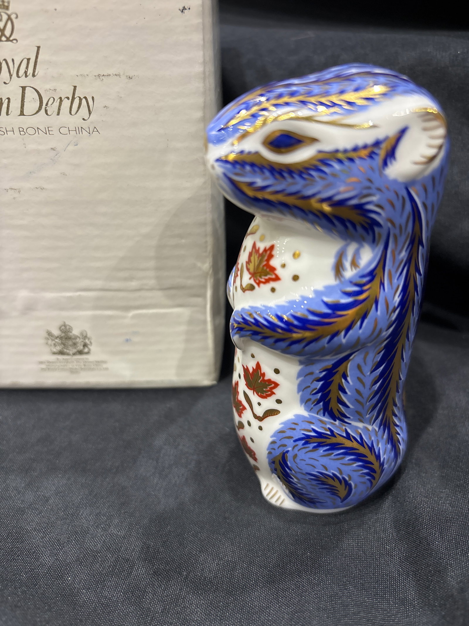 Pretty blue Chipmunk Royal Crown Derby 3&1/2 inch paperweight: Pretty blue Chipmunk Royal Crown Derby 3&1/2 inch paperweight. Gold stopper. Original white box. Very good condition with no chips, cracks, etc.