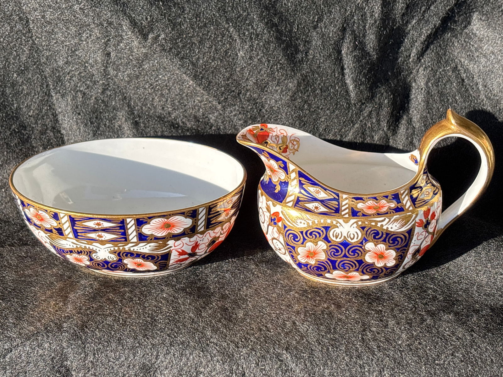 Antique Old Imari 2451 pattern Royal Crown Derby sugar & open creamer: Antique Old Imari 2451 pattern Royal Crown Derby sugar & open creamer. Gold handled creamer is 3& 1/2 by 5, oval auger is 2 inches high by 4&1/4 at widest.very good condition.
