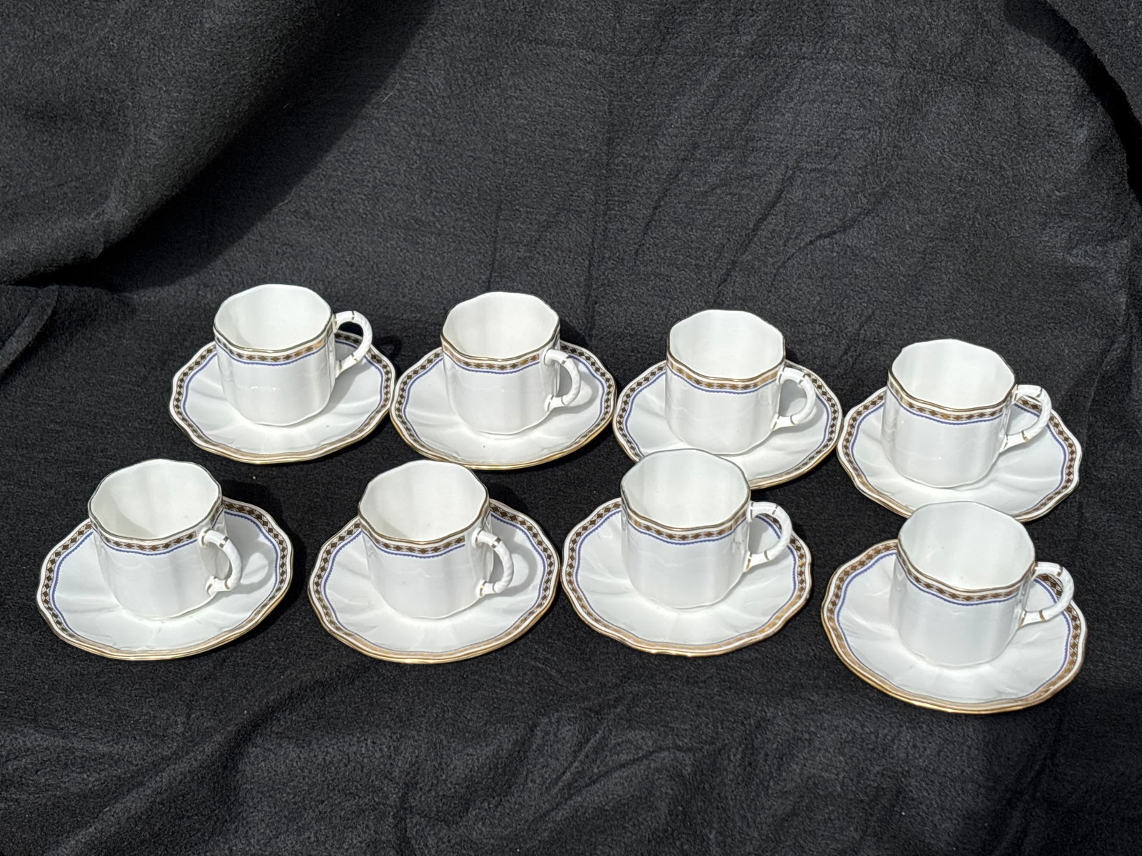 Eight Carlton blue A.1300 Royal Crown Derby England cups with saucers (16 items): Eight Carlton blue A.1300 Royal Crown Derby England cups with saucers (16 items). The cups are 2&1/2 by 2&1/2 inches and matching saucers are 5 inches across. Very good condition.Very good condition