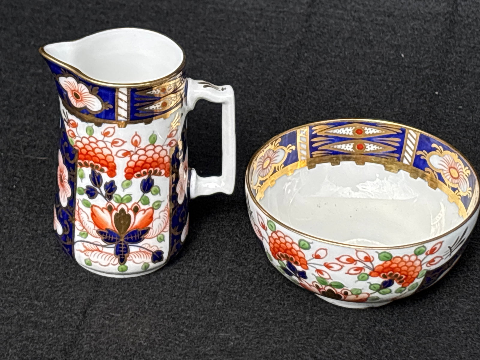 Very nice antique old Imari pattern Royal Crown Derby cream & sugar: antique old Imari pattern Royal Crown Derby. The creamer is 3&1/2 inches & the bowl is 3 inches. Very good condition