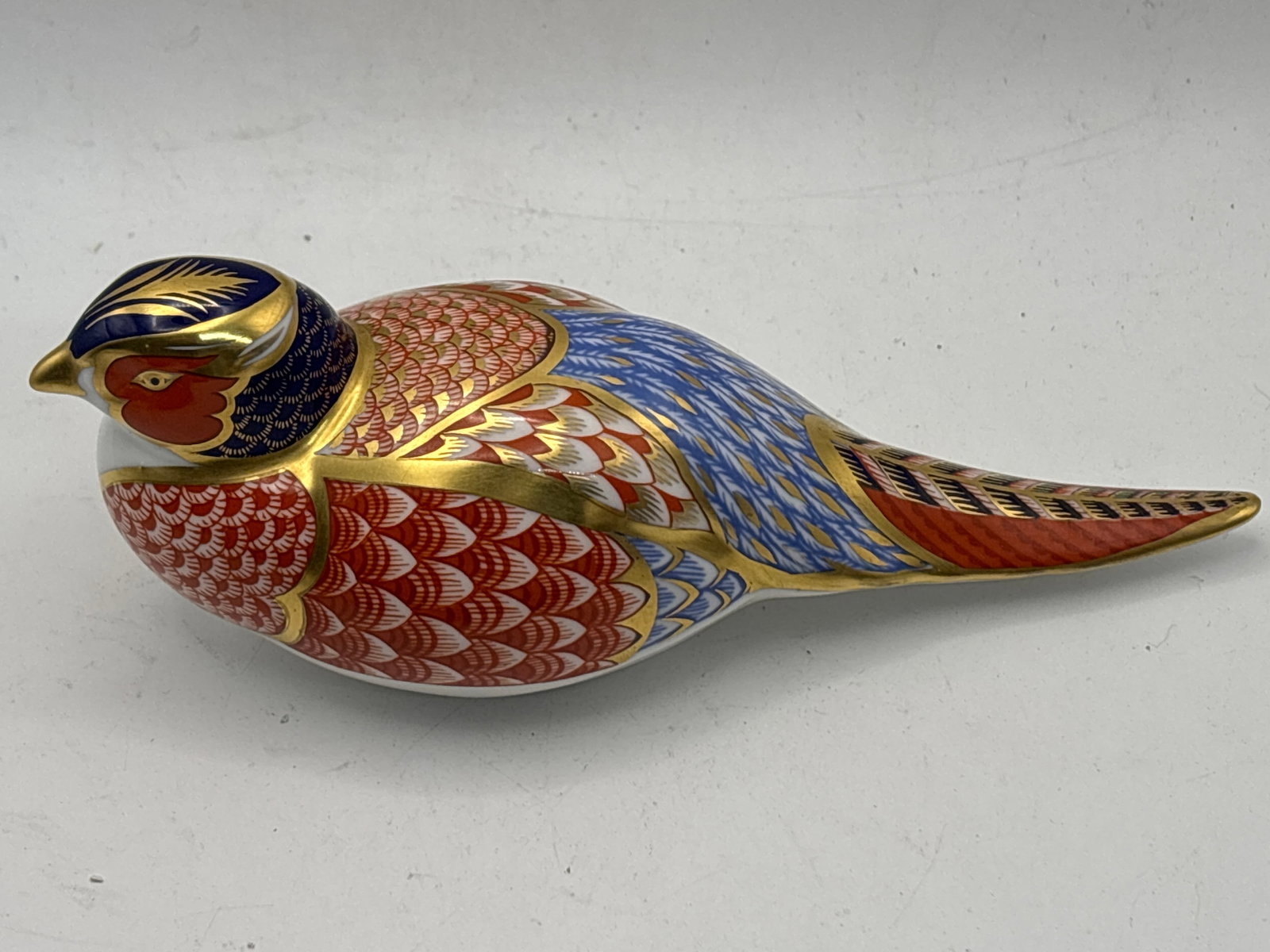 Pheasant form Royal Crown Derby England 7inch long paperweight: Pheasant form Royal Crown Derby England 7inch paperweight . No box. Silver Stopper.Very good condition