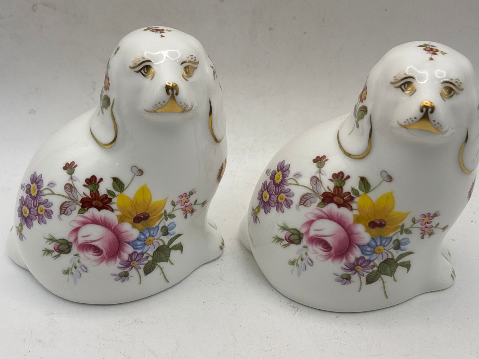 Two Limited Edition ‘The Spaniel’Derby Posies Royal Crown Derby 4 inch paperweights: Two Limited Edition ‘The Spaniel’Derby Posies Royal Crown Derby 4 inch paperweights. No box. Both silver stoppers.Very good condition