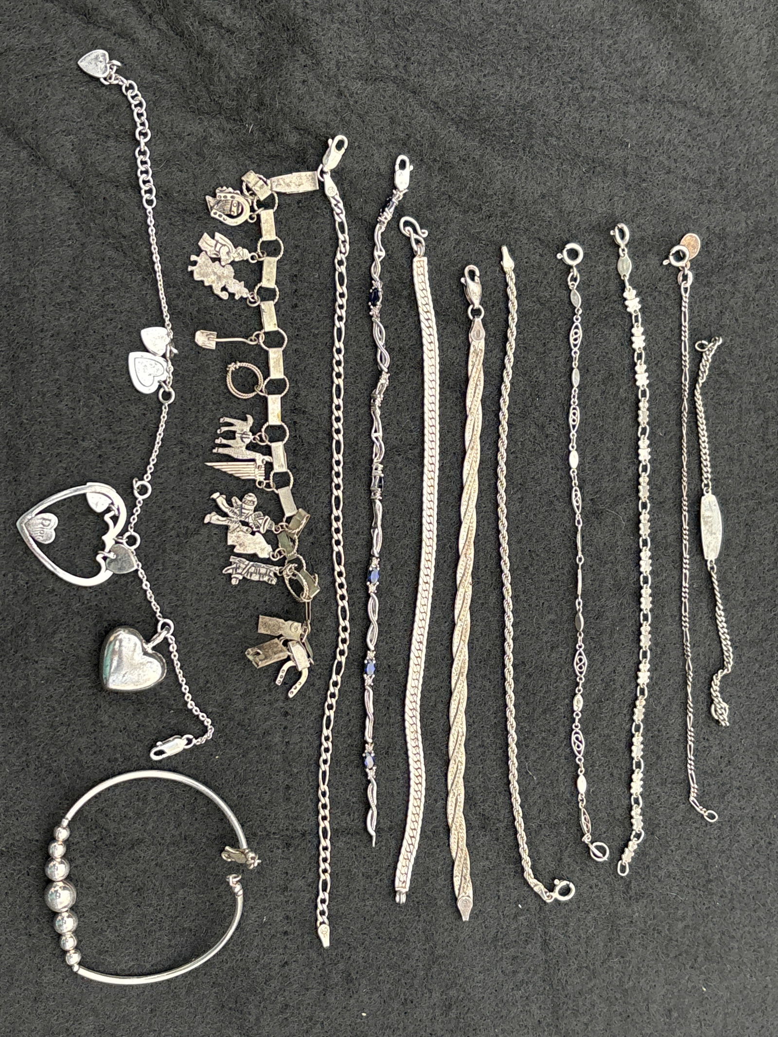 Group of twelve assorted sterling silver small bracelets; about 60 grams (1 of 8)
