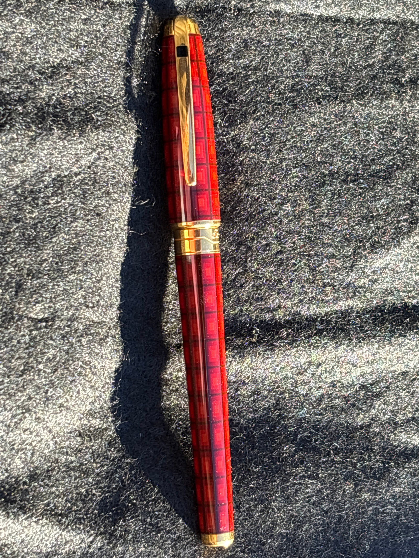 S.T. Dupont Olympio Vertigo writing Pen; 5&3/4 inches: S.T. Dupont Olympio Vertigo writing instrument, a special or limited edition pen known for its distinctive design and craftsmanship. This pen features a deep amber-brown tone with an intricate square 