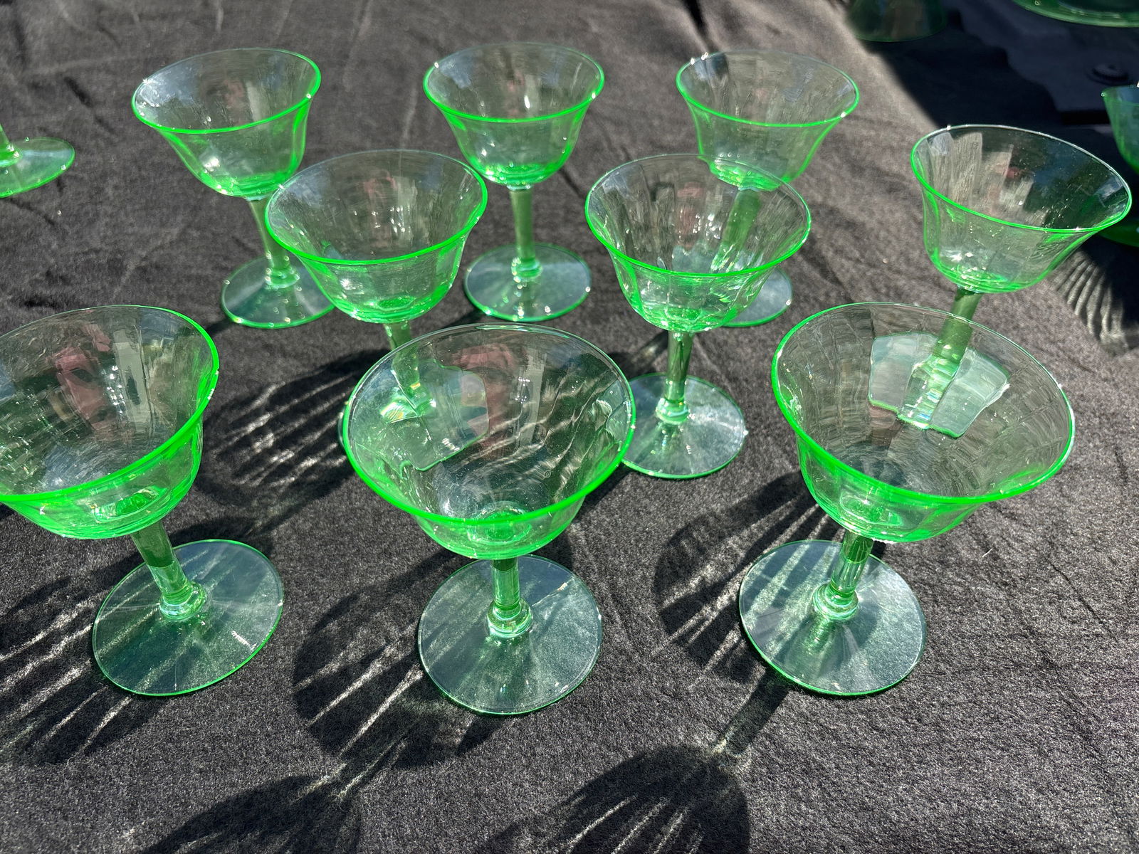 Set of nine antique depression era Vaseline/uranium 3&1/4inch glasses,no chios: Set of 9 antique depression era Vaseline/uranium 3&3/4 inch glasses. Vertical subtle line design. A little over 3 inches at top and 3 inches at bottom.All very good with no chips.