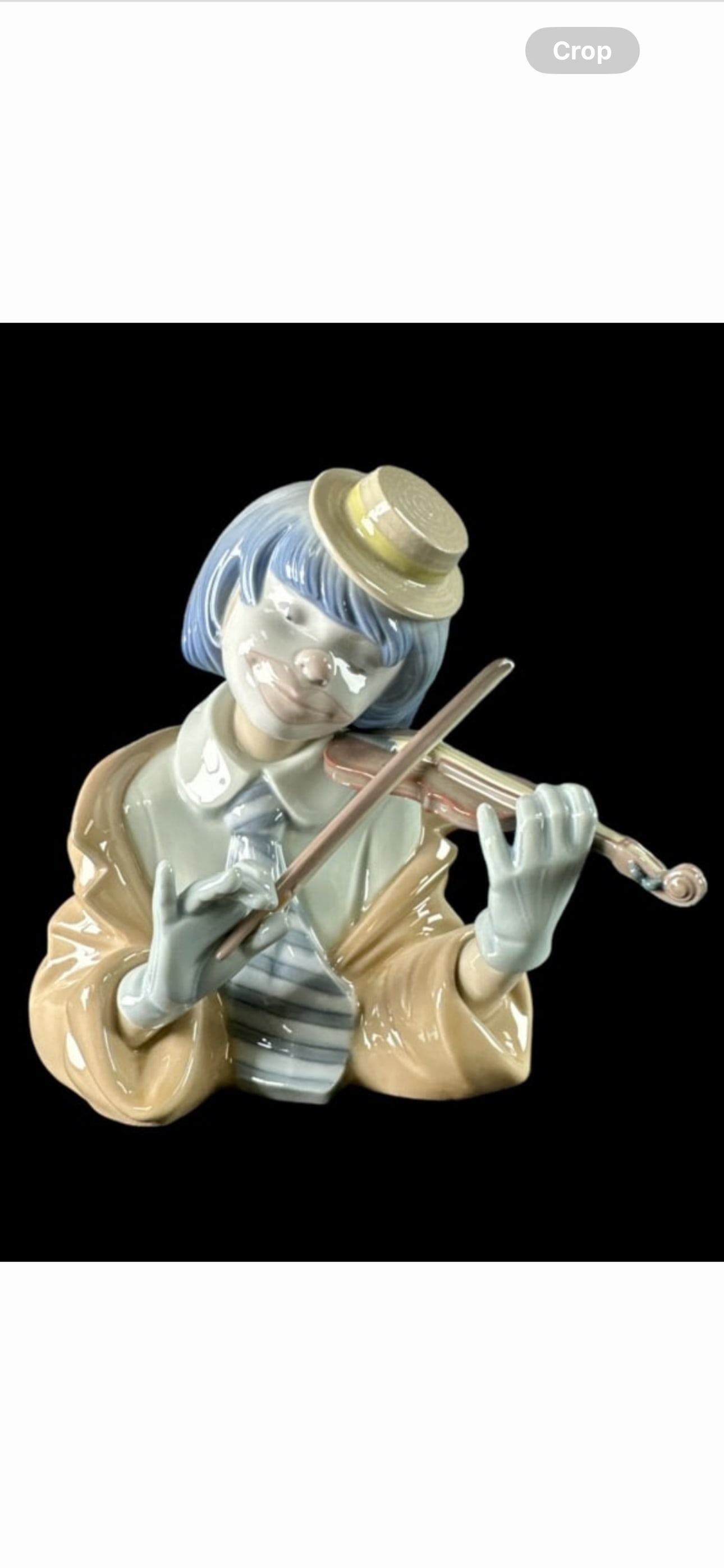 Lladro Spanish glazed porcelain sculpture titled "The Blue" or "Busto Payasito Violinista" number 5: Lladro Spanish glazed porcelain sculpture titled "The Blue" or "Busto Payasito Violinista" number 5600.Sculpted by Francisco Catalá.Issued in 1989 and retired in1993. Measures approx. 6"height. Inclu
