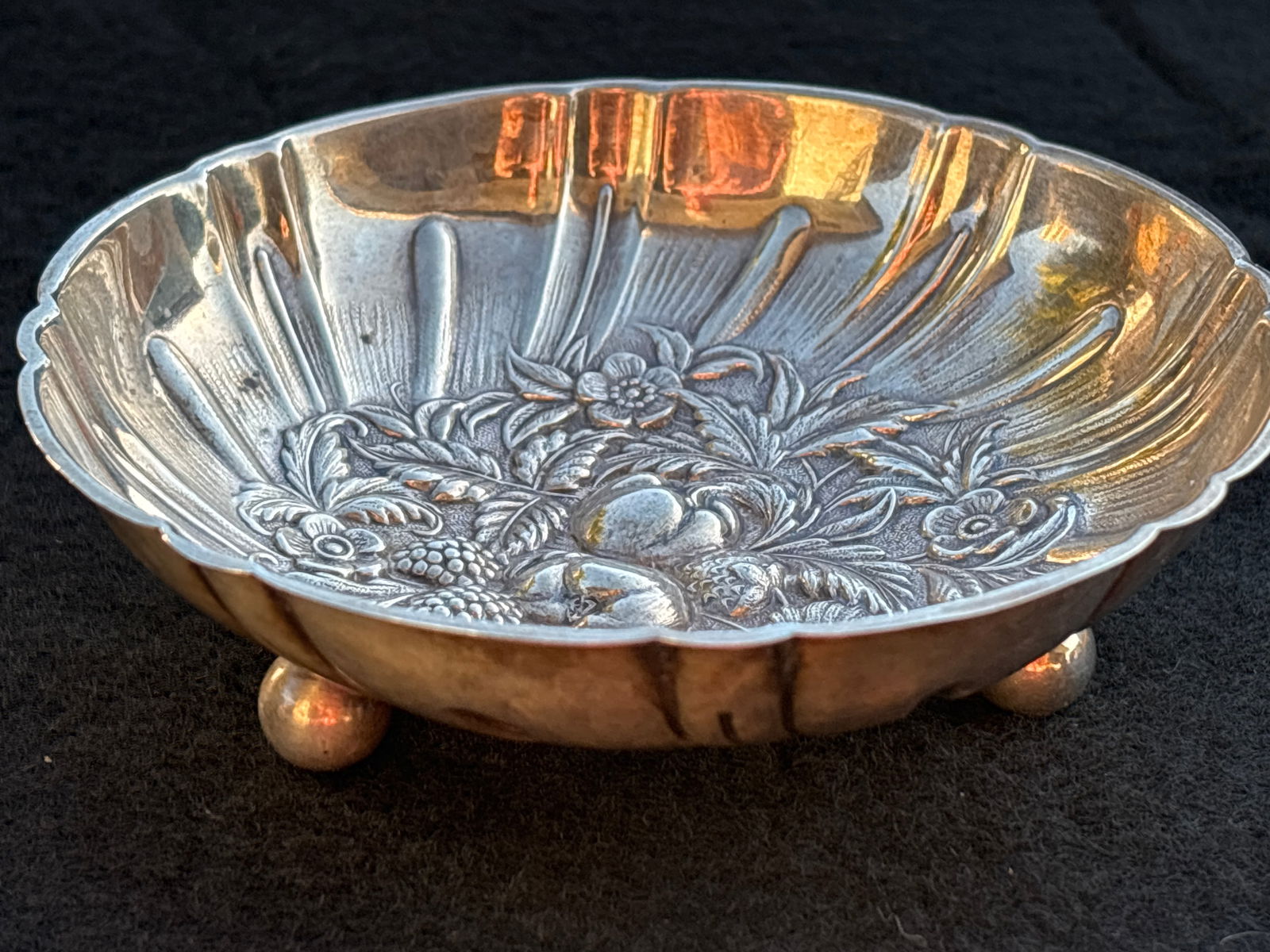 Ornate Antique Vict. S. Kirk and sons sterling silver 4&3/4 inch ball footed bowl; 75grams: Ornate Antique Vict. S. Kirk and sons sterling silver 4&3/4 inch ball footed bowl; 75grams.It has makers name mark on bottom side & sterling. It is about 1&1/2inches high. Hat form. Good condition; no