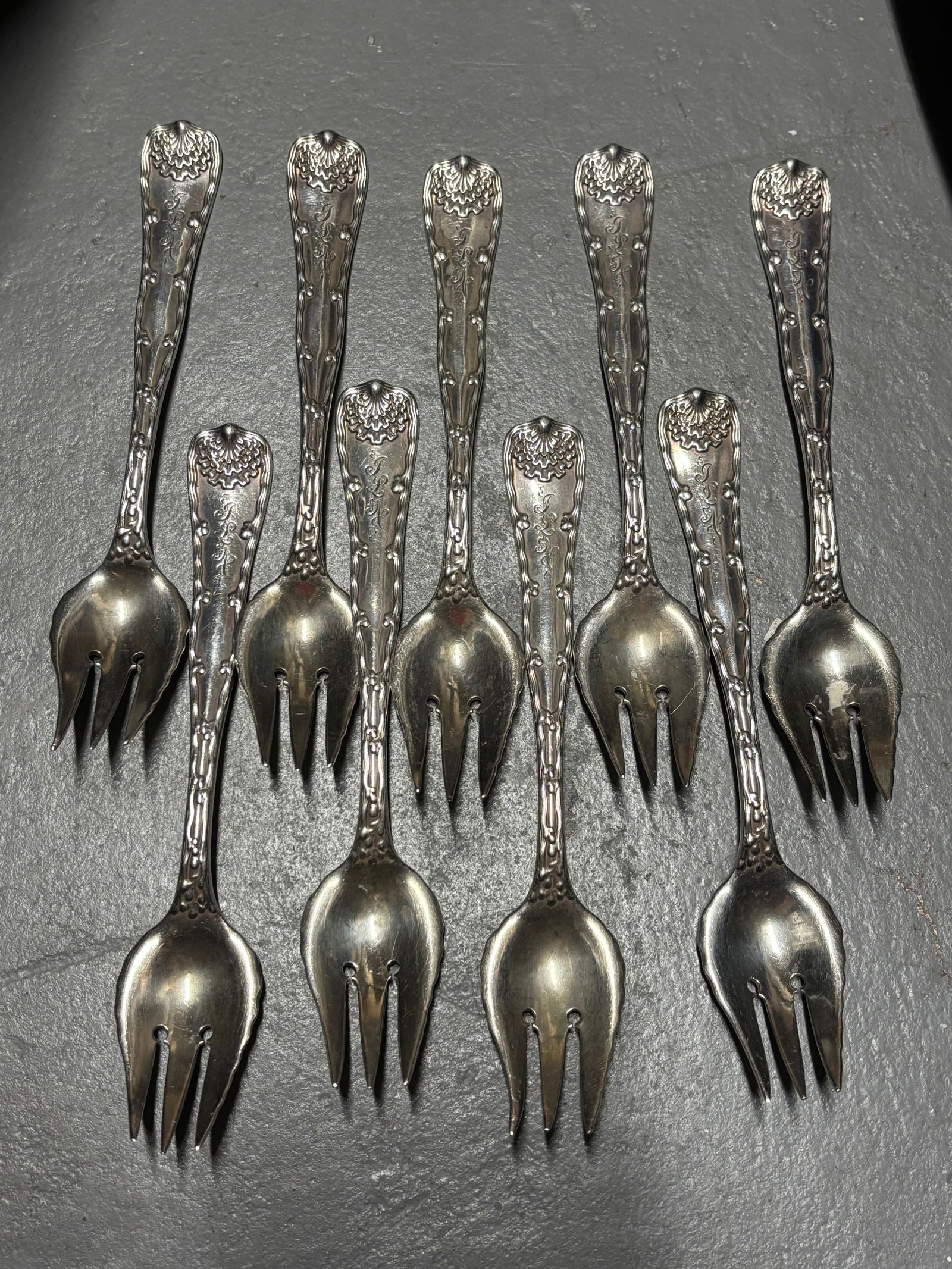 Set of nine Tiffany & Co. Sterling silver 6&1/4 inch cocktail forks; 440 grams (1 of 6)
