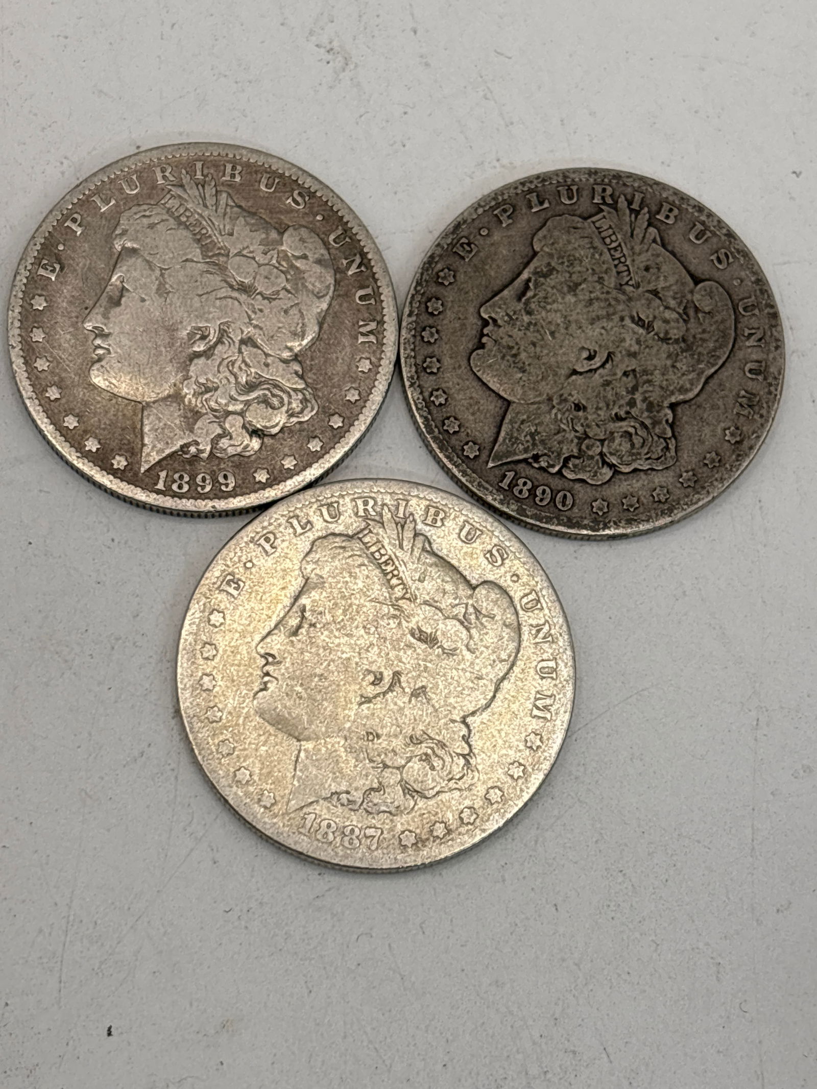 Three original early dated Morgan American silver dollars, worn (1 of 5)