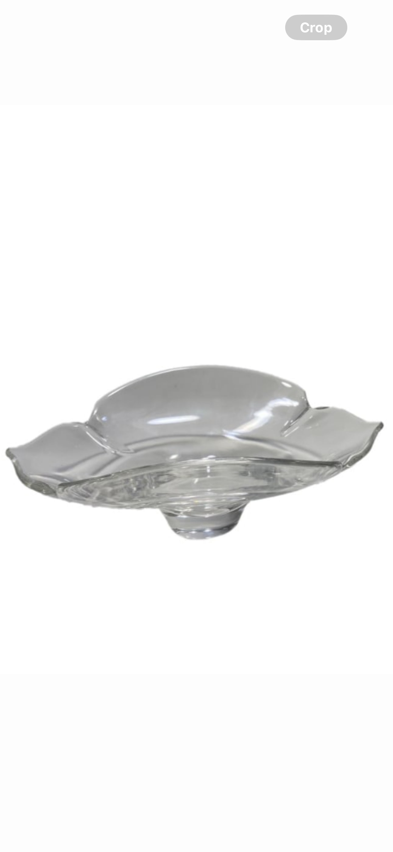 Signed Steuben clear crystal ‘Calix Leaf’ design 7 inch bowl: Steuben clear crystal piece, lobed pedestal bowl titled Calix Leaf by Donald Pollard. signed Steuben on the base, measures approximately 7 inches wide.Good overall condition having normal surface wear