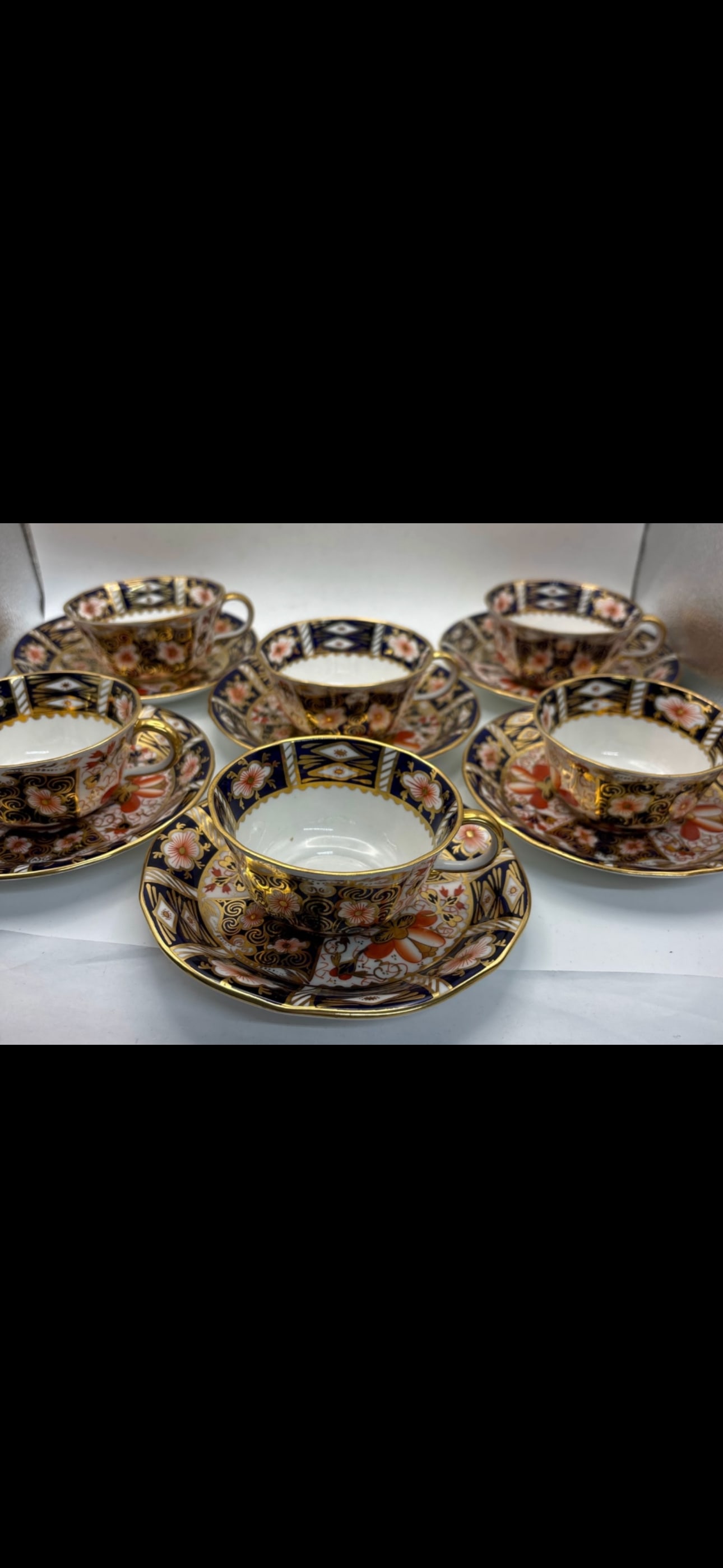 Set of six 2451 pattern Royal Crown Derby tea cups with saucers: Set of six 2451 pattern Royal Crown Derby tea cups with saucers. The cups are 3&1/2 across top & 1&3/4 high, matching saucers are 5&1/2 inches.Great colors and wonderful gold accents. Very good condit