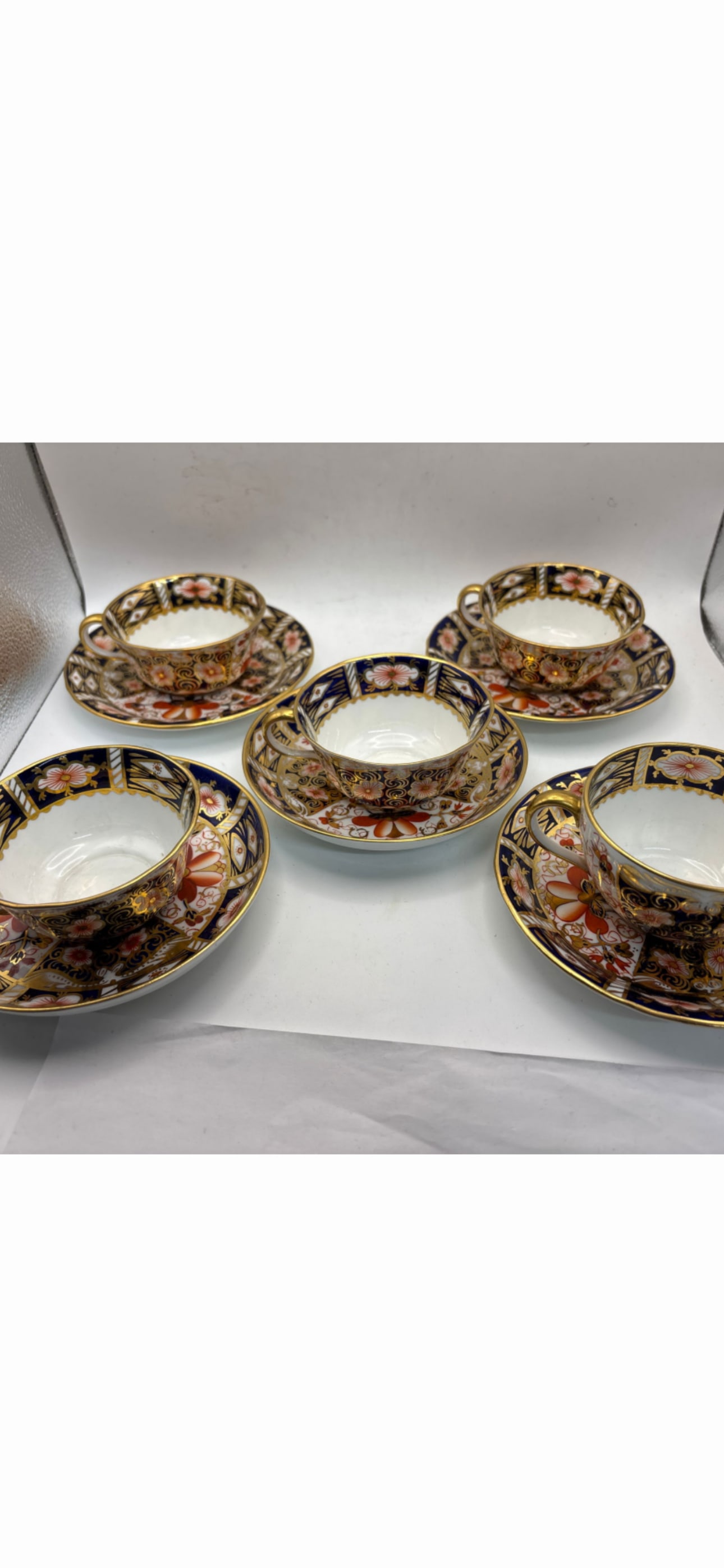 Set of five 2451 pattern Royal Crown Derby tea cups with saucers: Set of five 2451 pattern Royal Crown Derby tea cups with saucers. The cups are 3&1/2 across top & 1&3/4 high, matching saucers are 5&1/2 inches.Great colors and wonderful gold accents. Very good condi