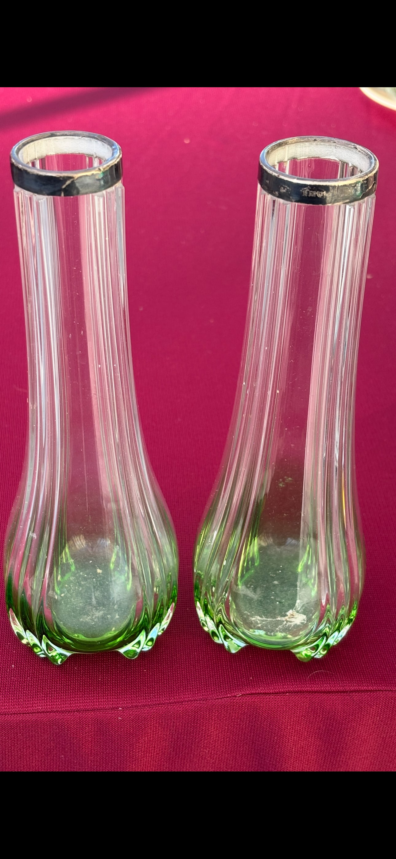 Silver hallmarked collar pair Vict green shading to clear 8 inch vases: Silver hallmarked collar pair Vict green shading to clear 8 inch vases. Lion English silver hallmarked rims. They are 1&1/3 at top and 3 inches at bottom. Unsigned glass.Silver is tarnished but no dam