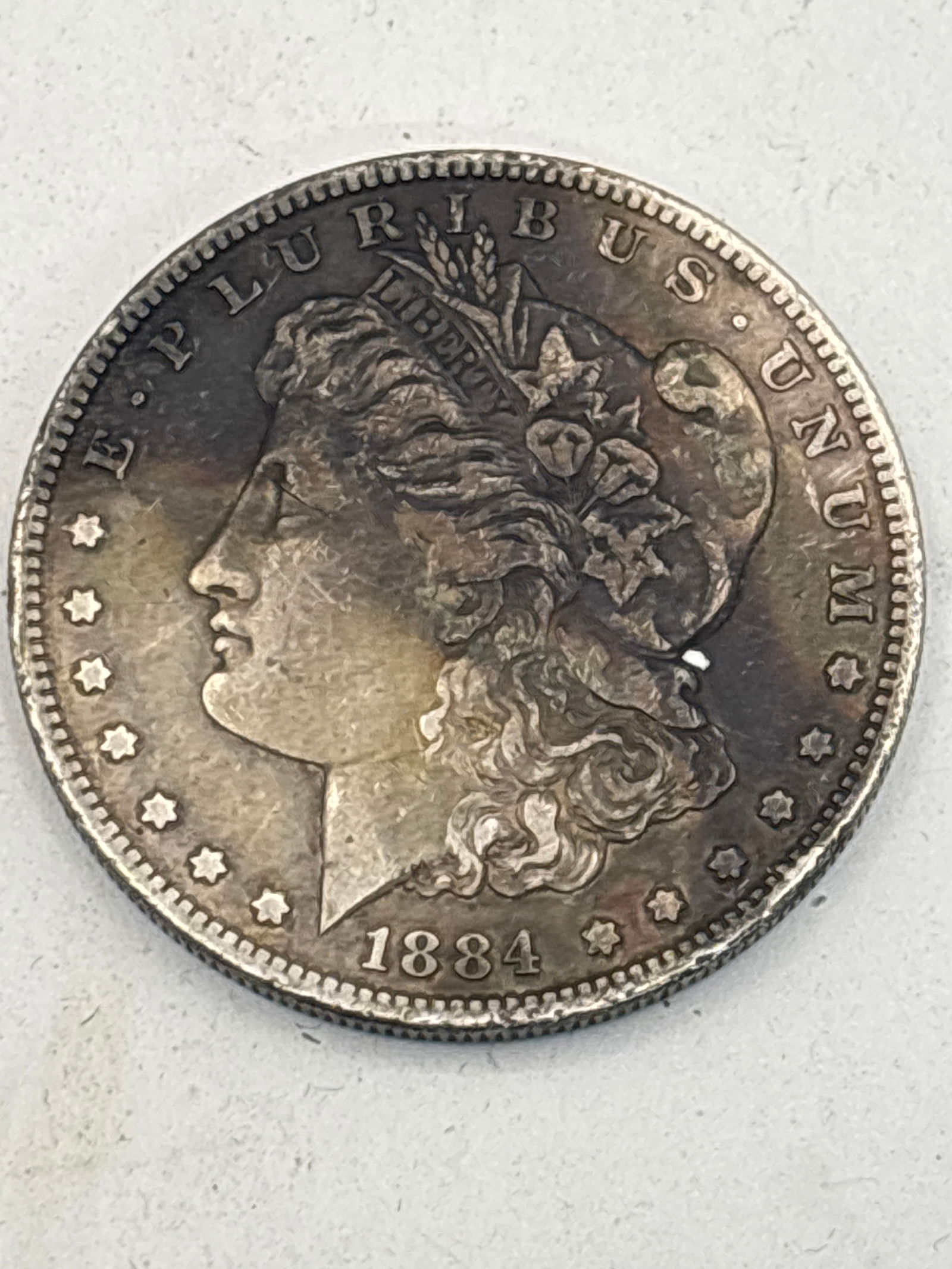 Early original 1884 silver Morgan dollar coin, tarnished (1 of 4)