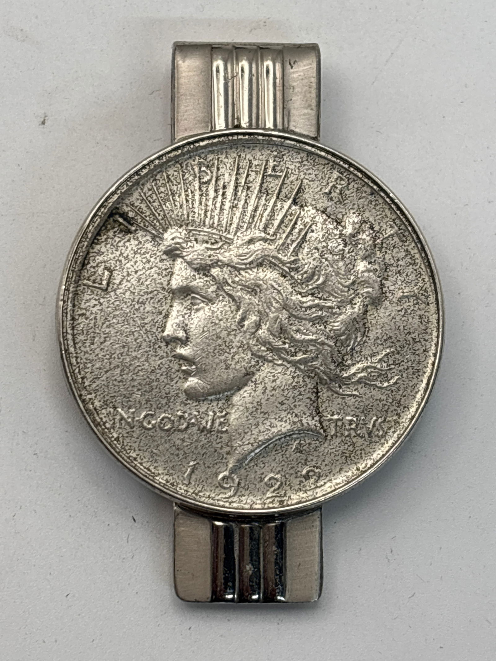 Sterling money clip with original 1922 silver Peace dollar coin; 50 grams total: Sterling money clip with original 1922 silver Peace dollar coin; 50 grams total.. Circulated condition
