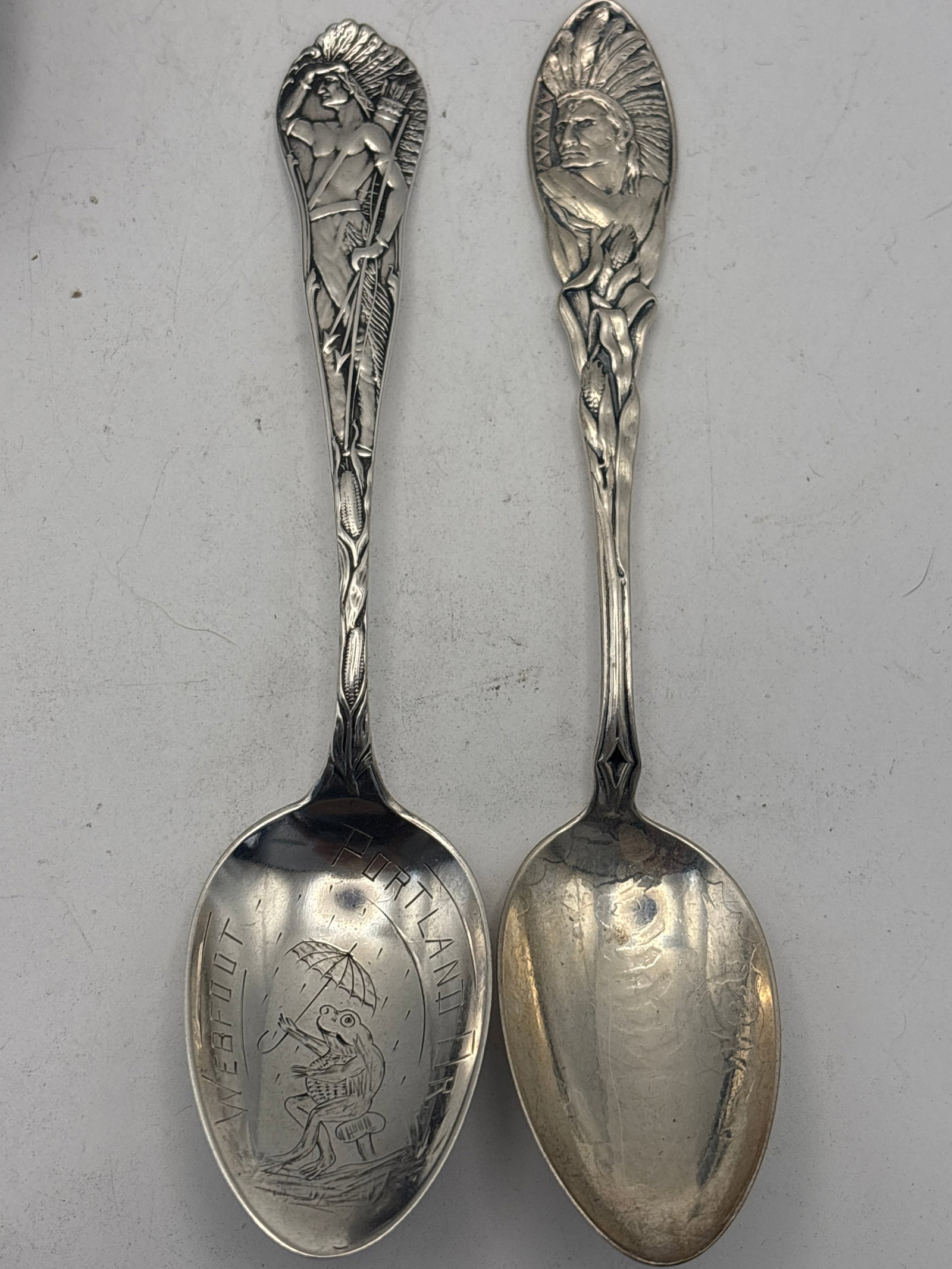 Two Native American Sterling 5&7/8 in spoons; 50 grams Portland, Or& 1892 Neb: Two Native American Sterling 5&7/8 in spoons; 50 grams Portland, Or& Neb. The Nebraska is worn on the bowl .Tarnish used condition
