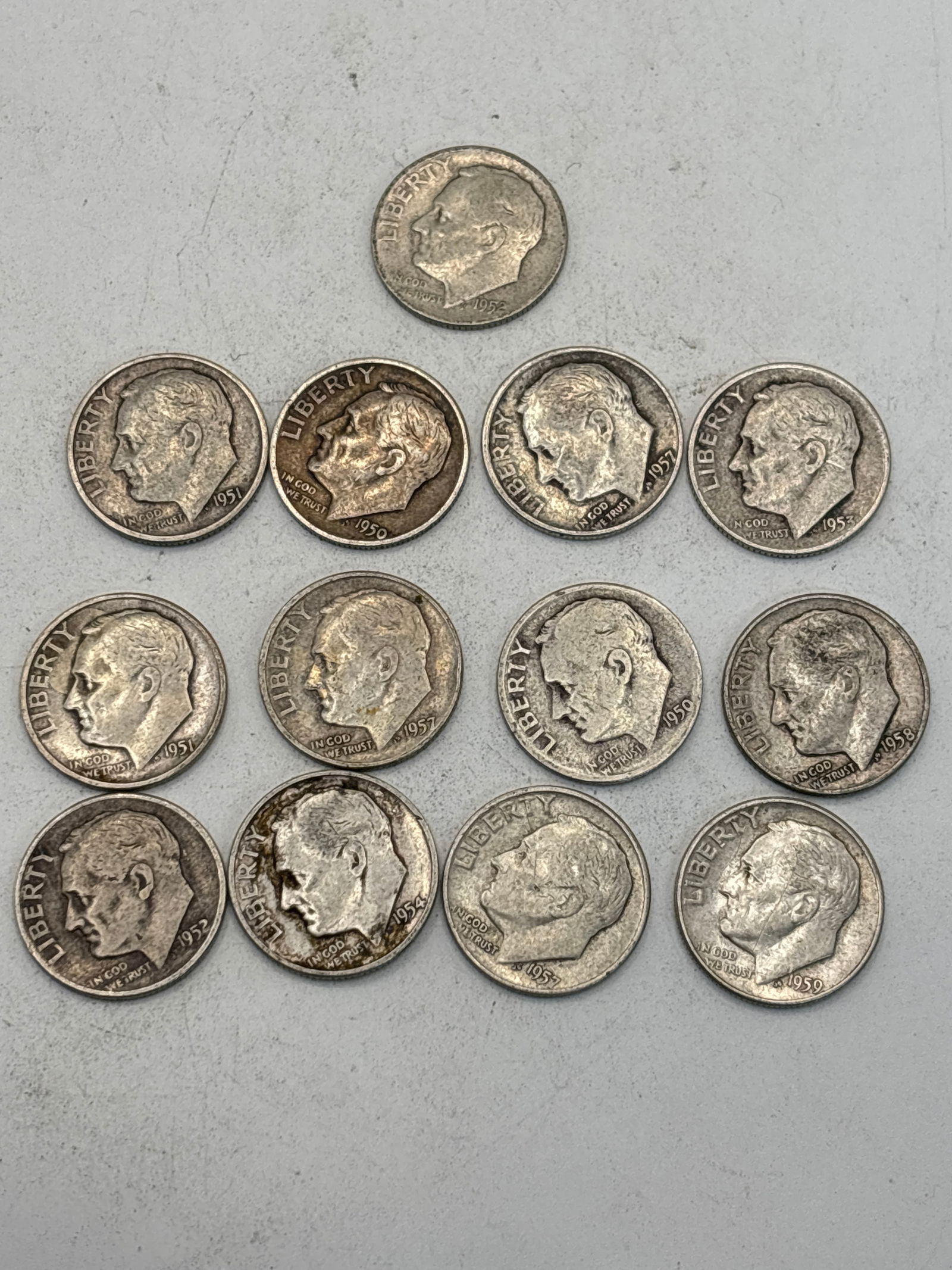 Thirteen dated 1950’s Roosevelt silver dimes, various dates (1 of 5)