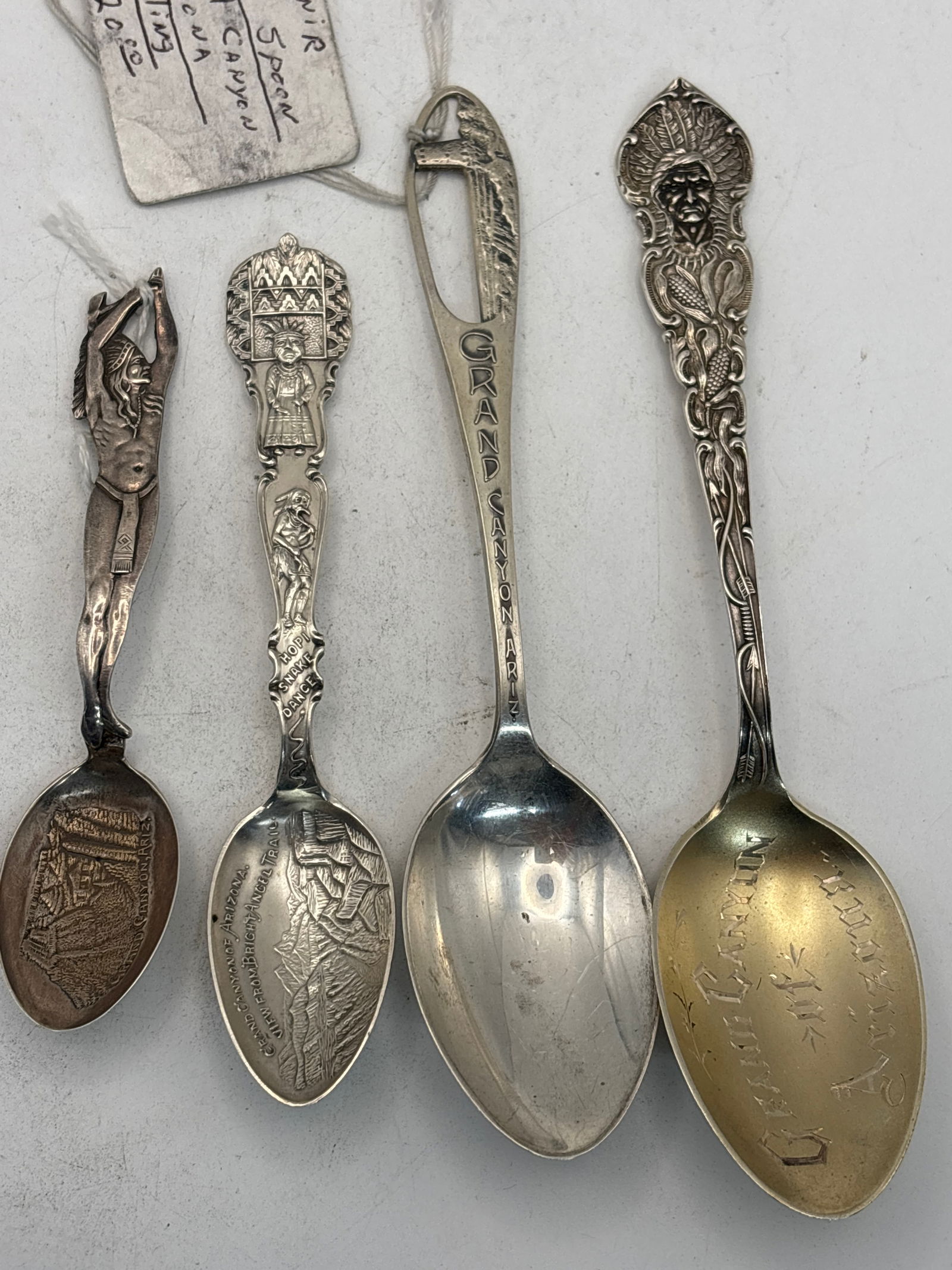 Four Grand Canyon & Az. Native American souvenir spoons; 71 grams: Four Grand Canyon & Az. Native American souvenir spoons; 71 grams. A 5&3/4 inch Grand Canyon, a5&1/2 inch pierced through Grand Canyon, a 4&1/3 inch Bright Angel Trail with a Hopi Indian Snake Dance &
