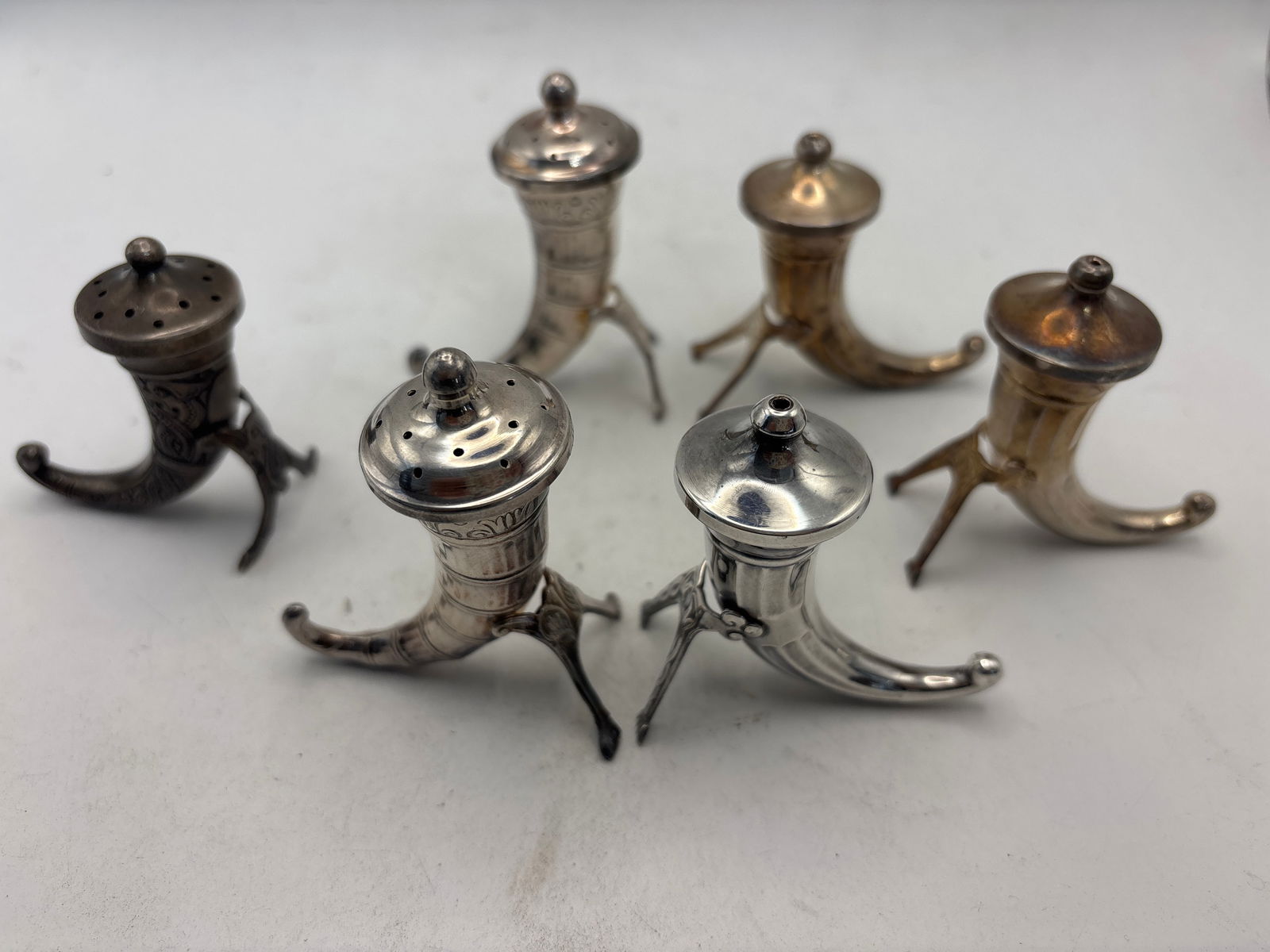Set of six Sweden sterling silver horn form 2&3/4 inch shakers; 105 grams: Set of six Sweden sterling silver horn form 2&3/4 inch shakers; 105 grams. The pepper shakers are slightly smaller.Good condition
