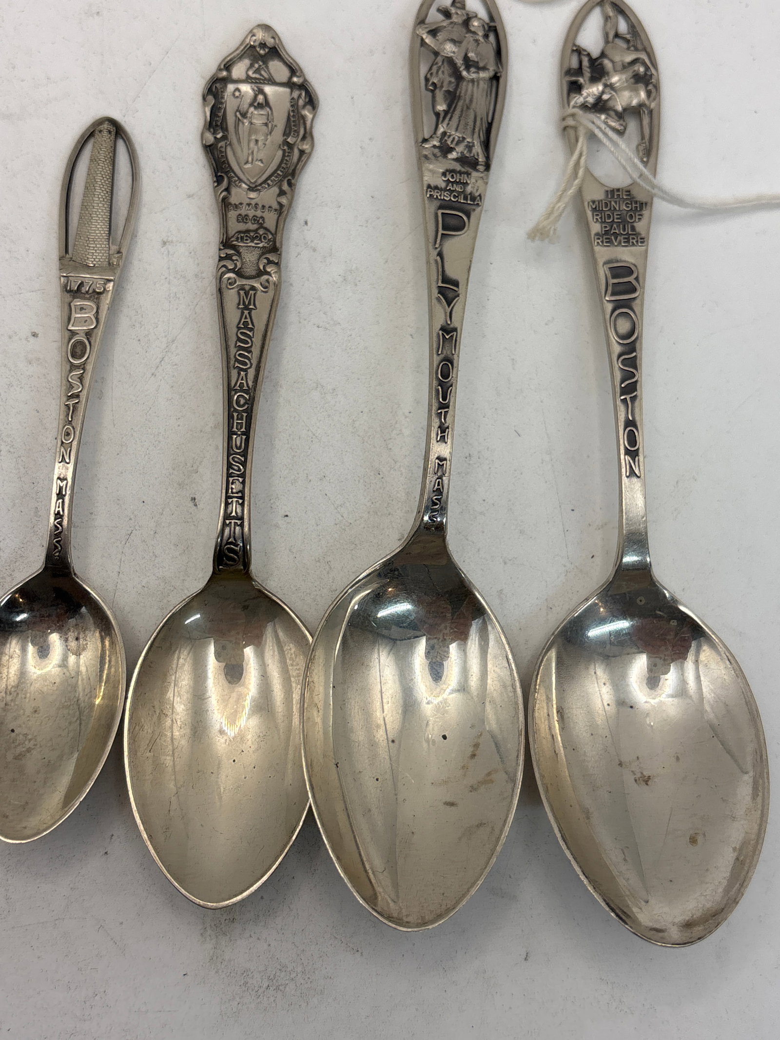 Four Boston & Plymouth, Mass. sterling silver souvenir spoons; 75 grams: Four Boston & Plymouth, Mass. sterling silver souvenir spoons; 75 grams . A 5&1/2 inch Plymouth and three Boston with smallest 4&1/8 inch.Good condition.