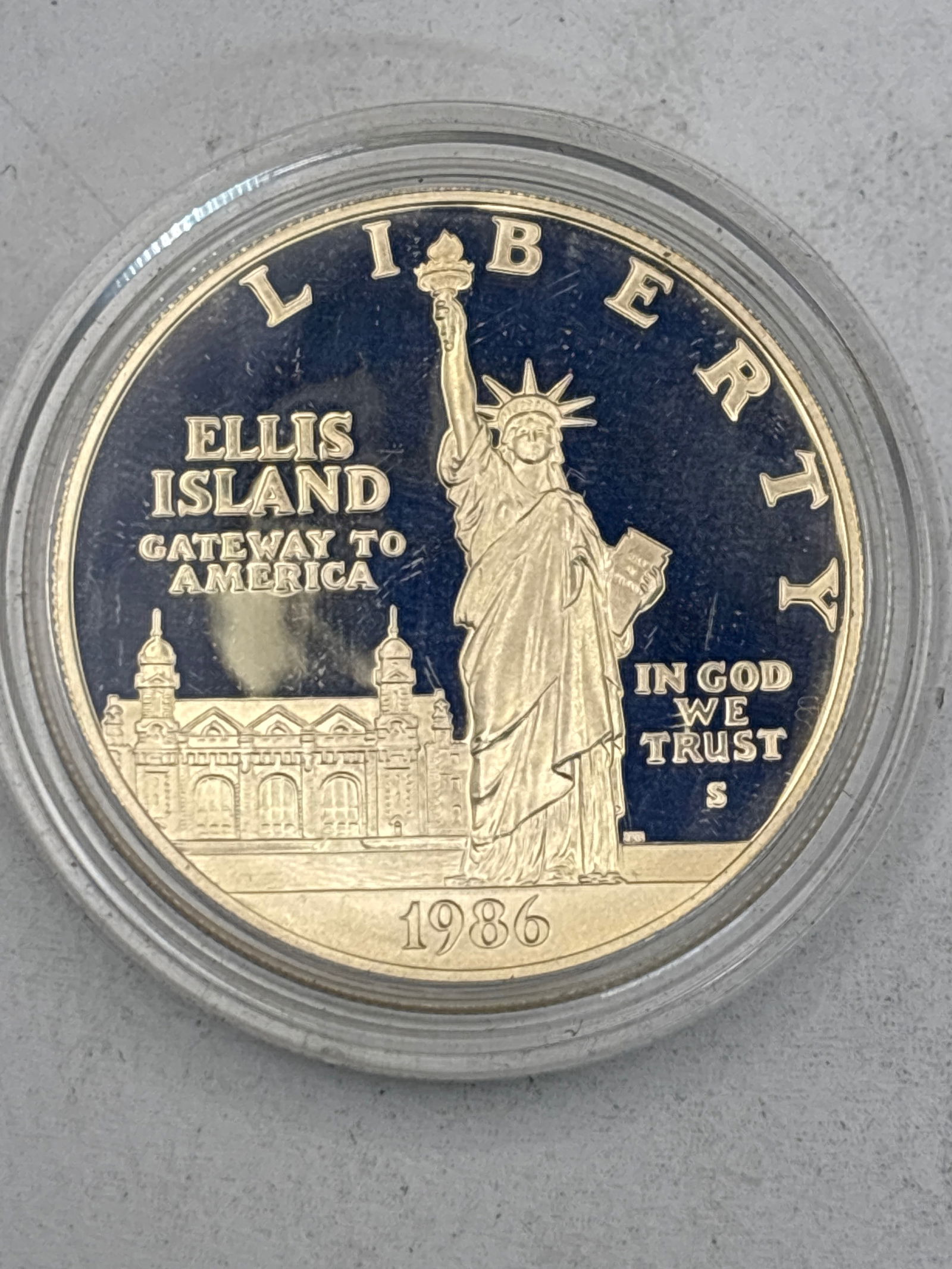 1986 Statue of Liberty Commemorative Silver Dollar: 1986 Statue of Liberty Commemorative Silver Dollar, issued to celebrate the centennial of the Statue of Liberty's dedication. The coin contains 0.7734 oz of silver.