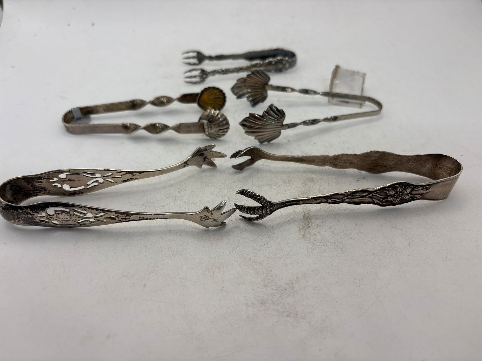 Five similar sterling Silver Victorian sugar tongs; 65 grams (1 of 5)