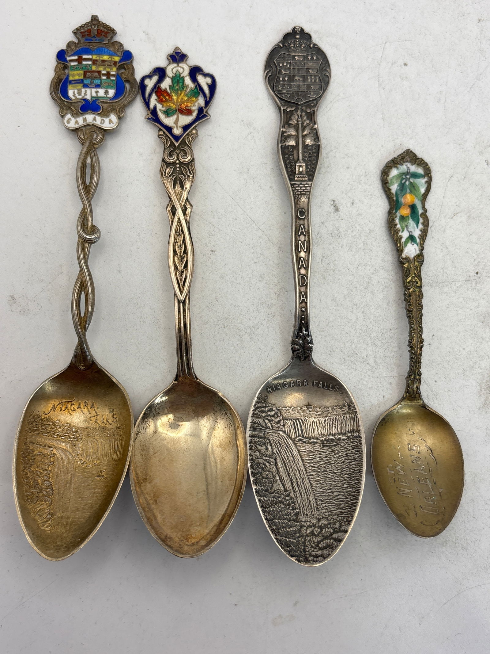 Four Canada (3 enamel) sterling silver souvenir spoons; 70 grams, 2 Niagara Falls (1 of 9)