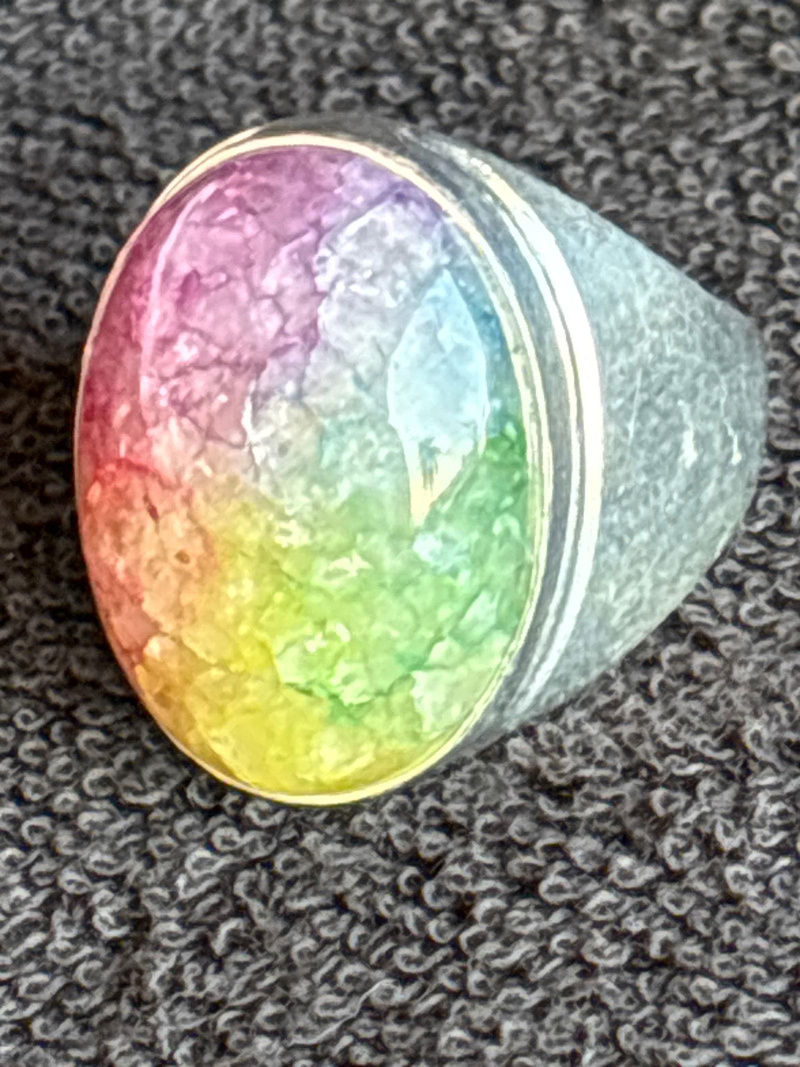 Rainbow stone set oval dome form sterling silver ring; 13 grams total: Rainbow stone set oval dome form sterling silver ring; 13 grams total. approximately 9&1/2-10 ring size.