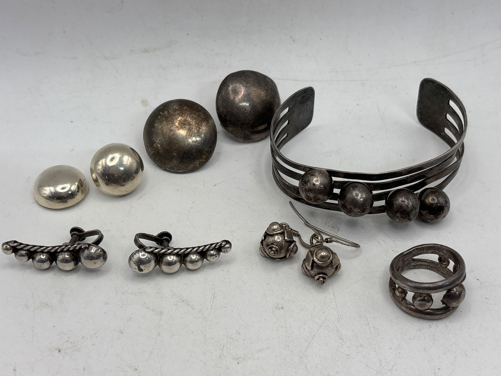 Ten pieces brutalist style ball form sterling silver group; 55 grams. (1 of 8)