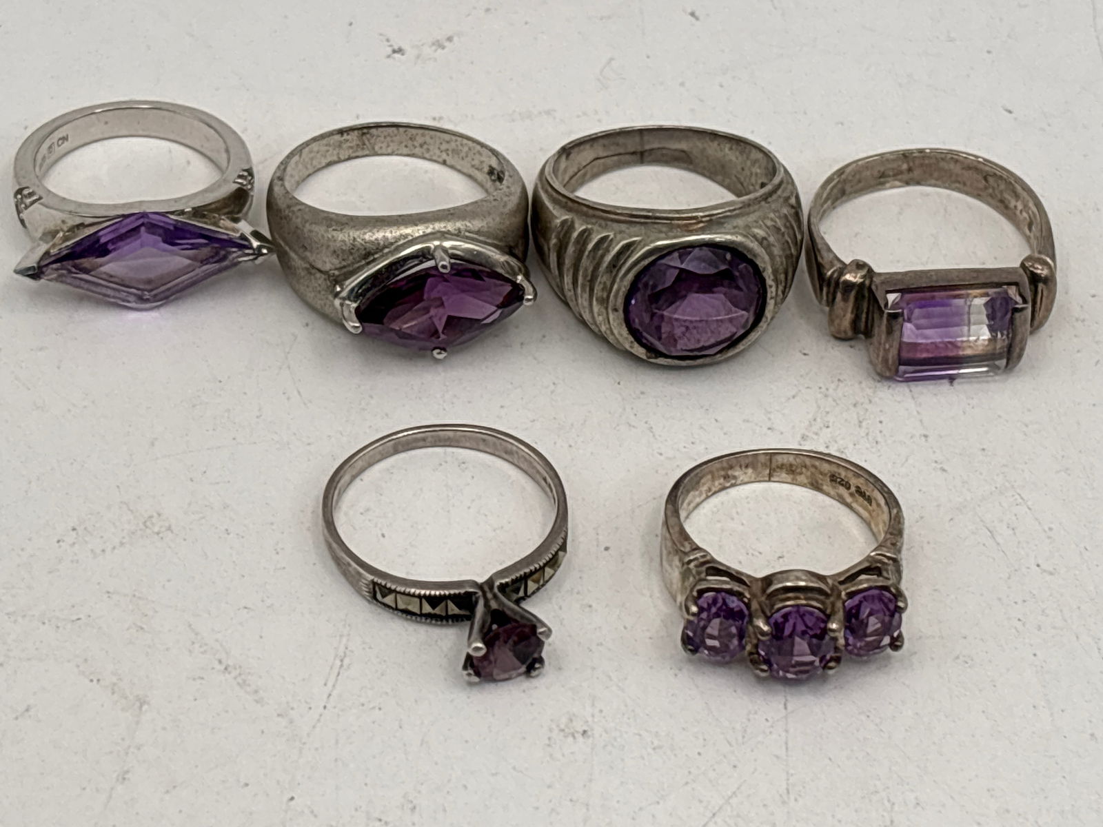 Nice Six similar amethyst stone inset Sterling silver rings; 40 grams. (1 of 8)
