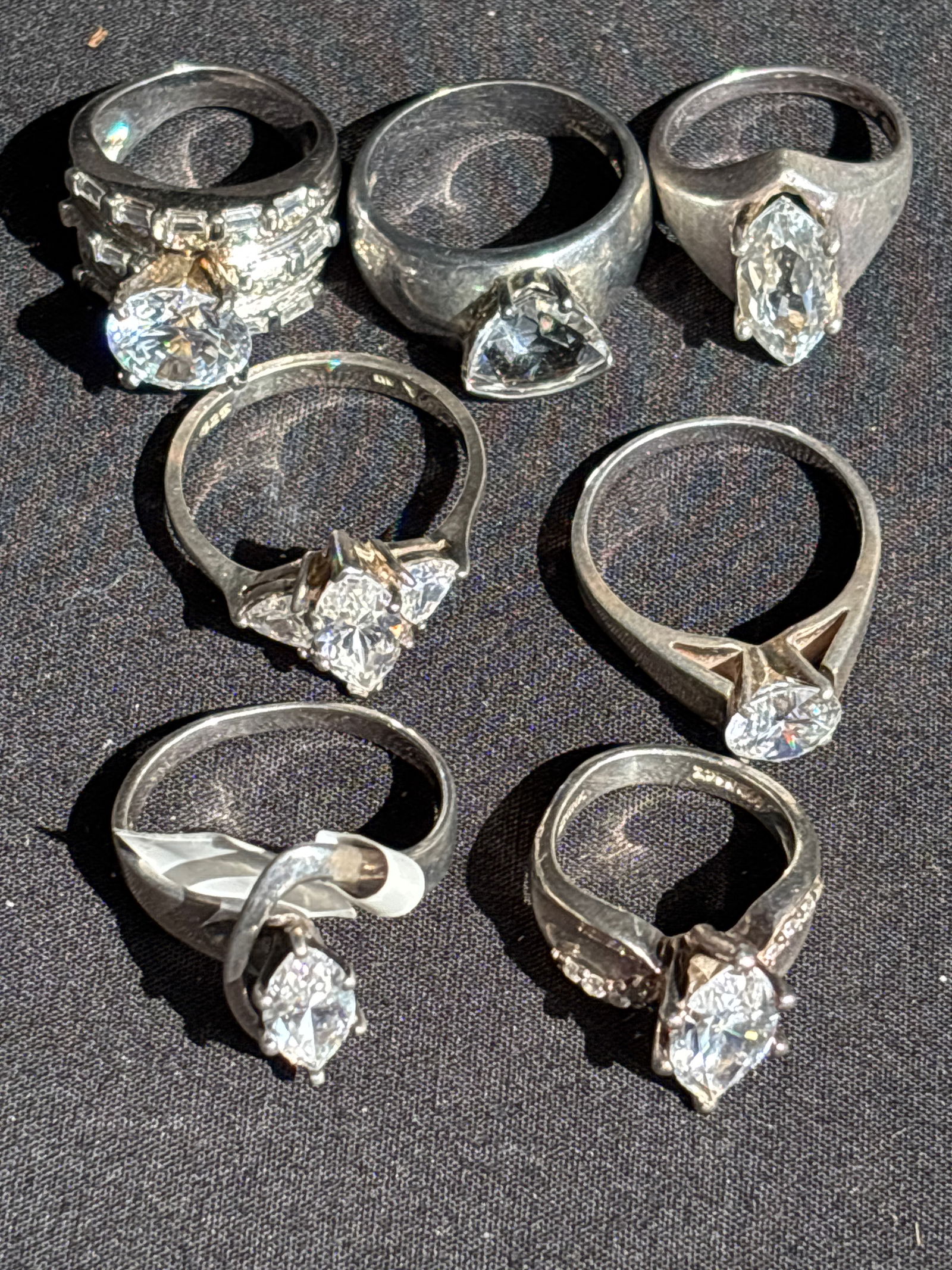 Seven similar large cubic zirconia/quartz Sterling silver engagement rings; 40 grams. (1 of 10)