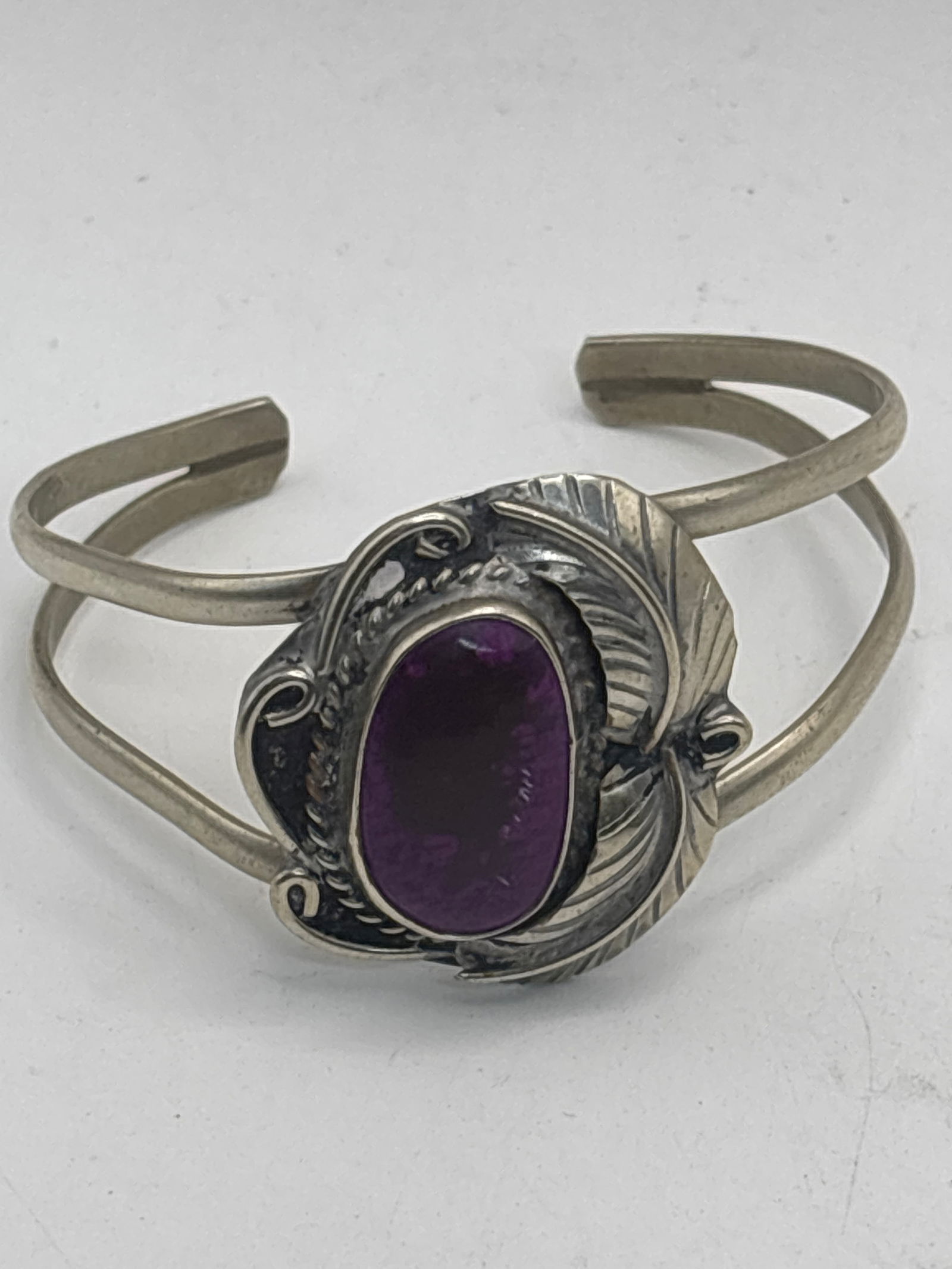 Vintage Native Mexican purple stone & sterling silver cuff bracelet; 20 grams: Native Mexican purple stone & sterling silver cuff bracelet; 20 grams.Interior circumference is 5&1/2 inches.
