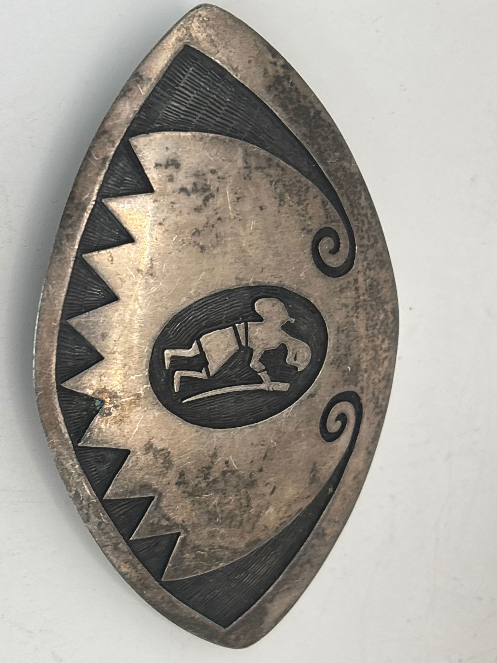 Native American Kokopelli design sterling silver belt buckle; 42 grams: vintage sterling silver Native American belt buckle, likely from a Hopi artisan, featuring a Kokopelli design. It is 2 by 3&1/2 inches.