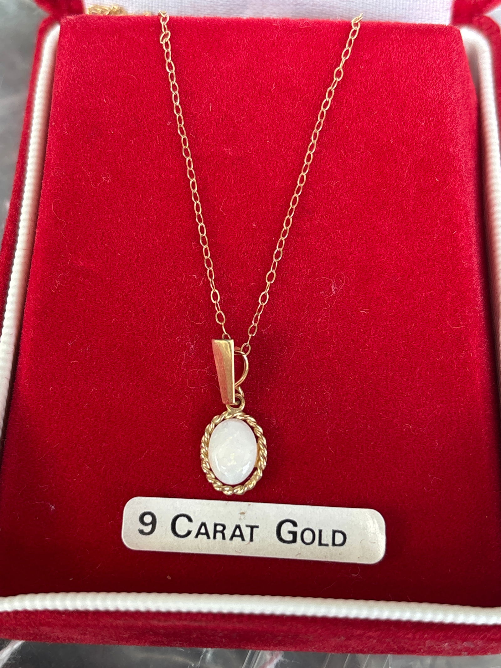 English 9 carat (9 k) gold necklace marked 375 with pendant droplet opal cabachon; 1 gram (1 of 8)