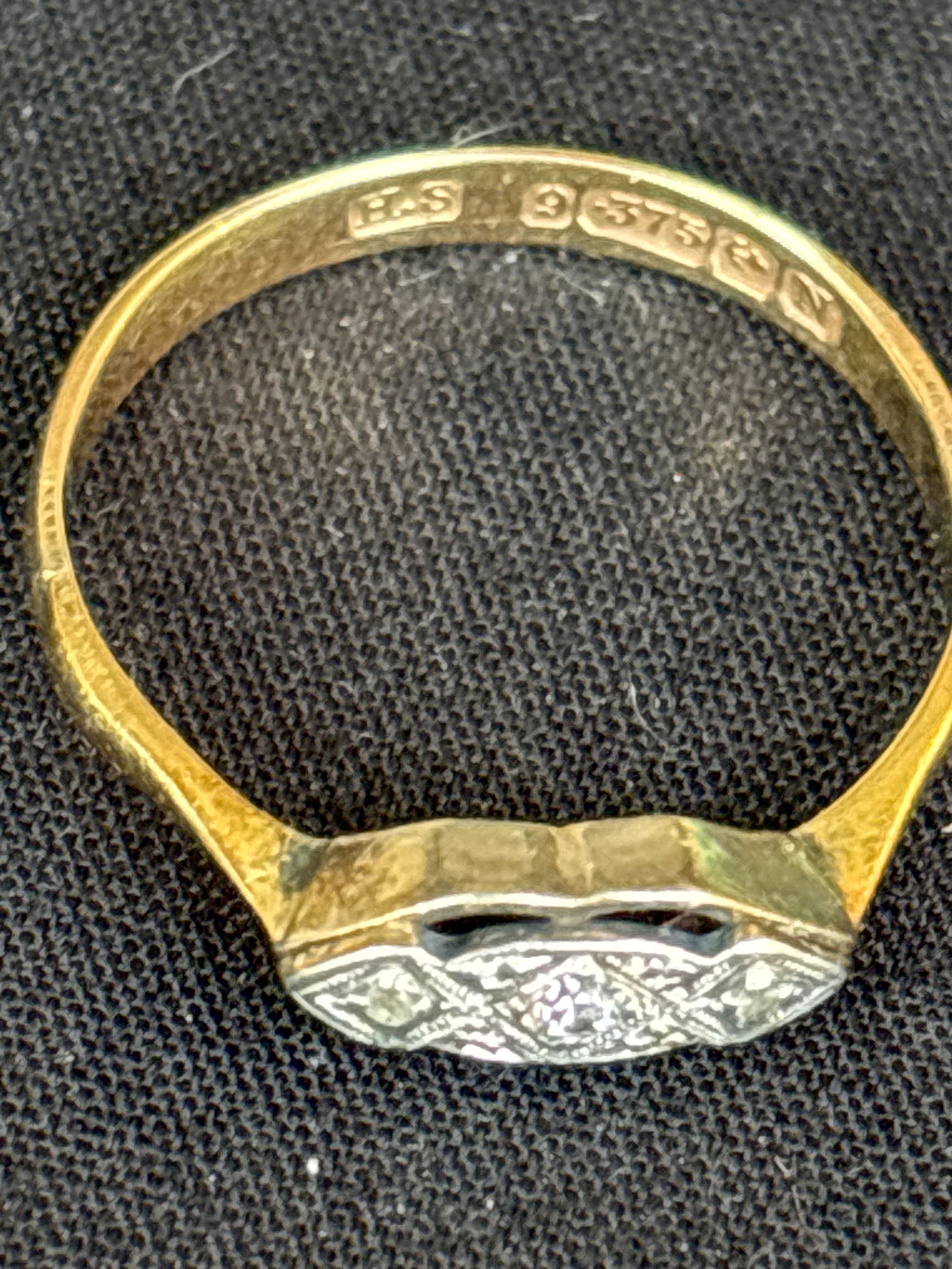 Antique English 9ct (9K) gold diamond trilogy ring; 1.6 grams: An Antique 9ct gold diamond trilogy ring,set with a central melee mixed cut diamond and two melee rose cut diamond, hallmarked "9 375" for 9ct gold, size O, approx. 1.6g gross