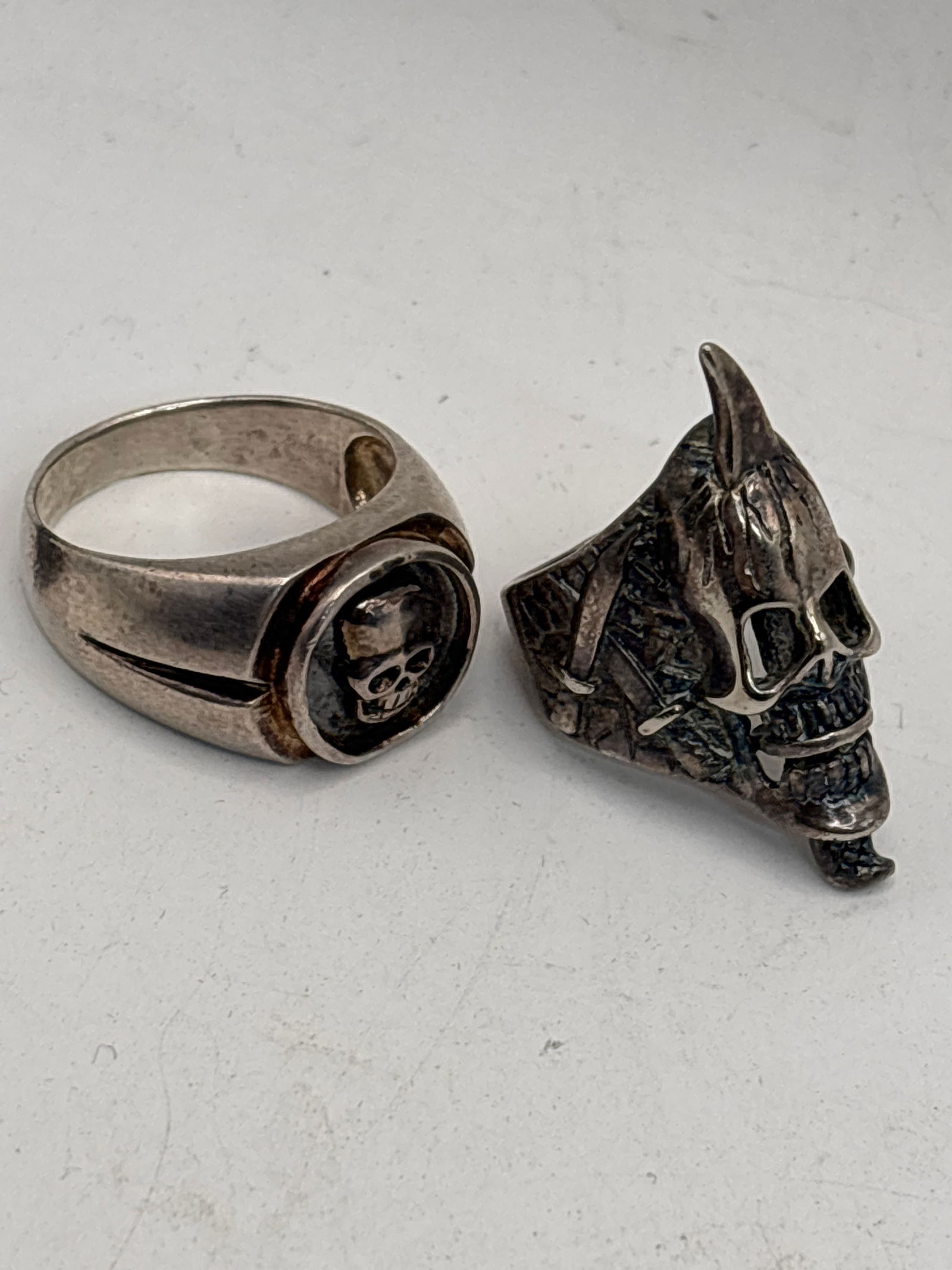 Two skull form large handcrafted sterling silver rings; 24 grams (1 of 9)