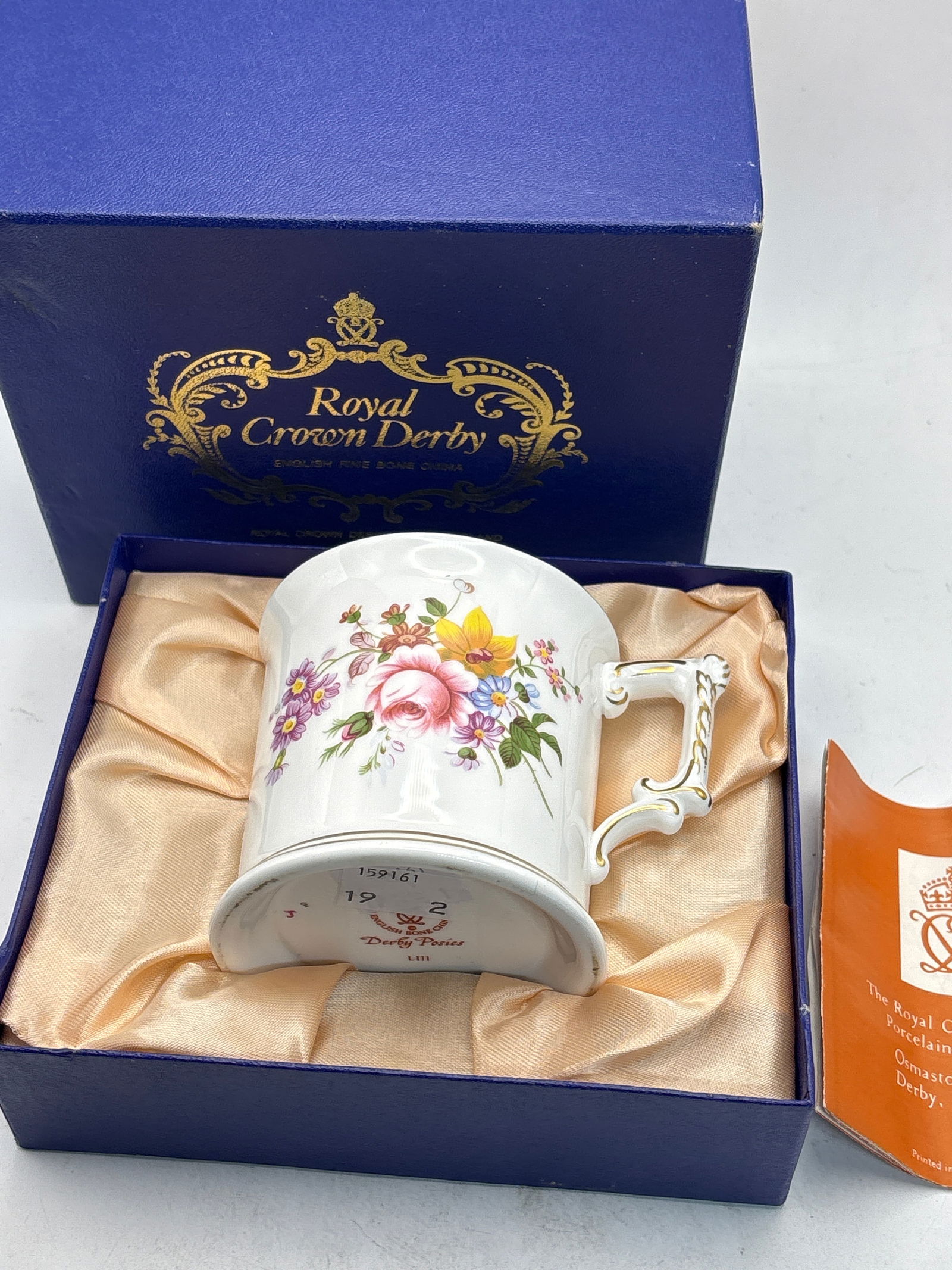 Derby Posies pattern Royal Crown Derby handled mug cup in fitted box: Derby Posies pattern Royal Crown Derby handled mug cup in fitted box. It is 3 by 3 inches.